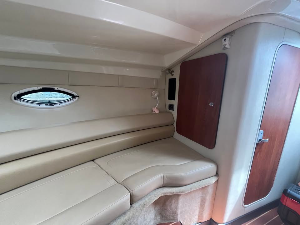 Interior of a 2011 Monterey 280SCR yacht with beige sofa.