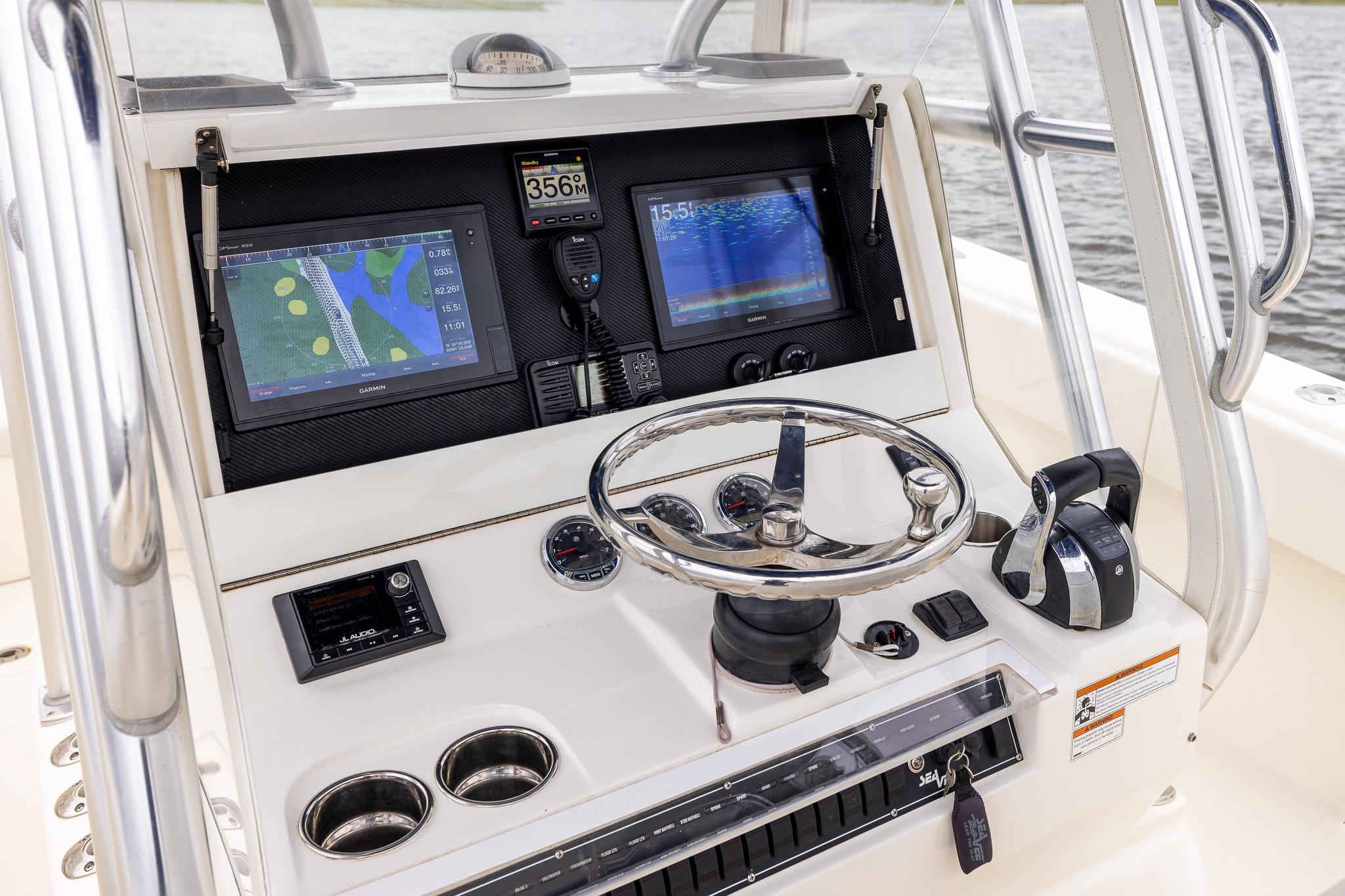 2019 SeaVee 322Z boat console with navigation screens, steering wheel, and controls.