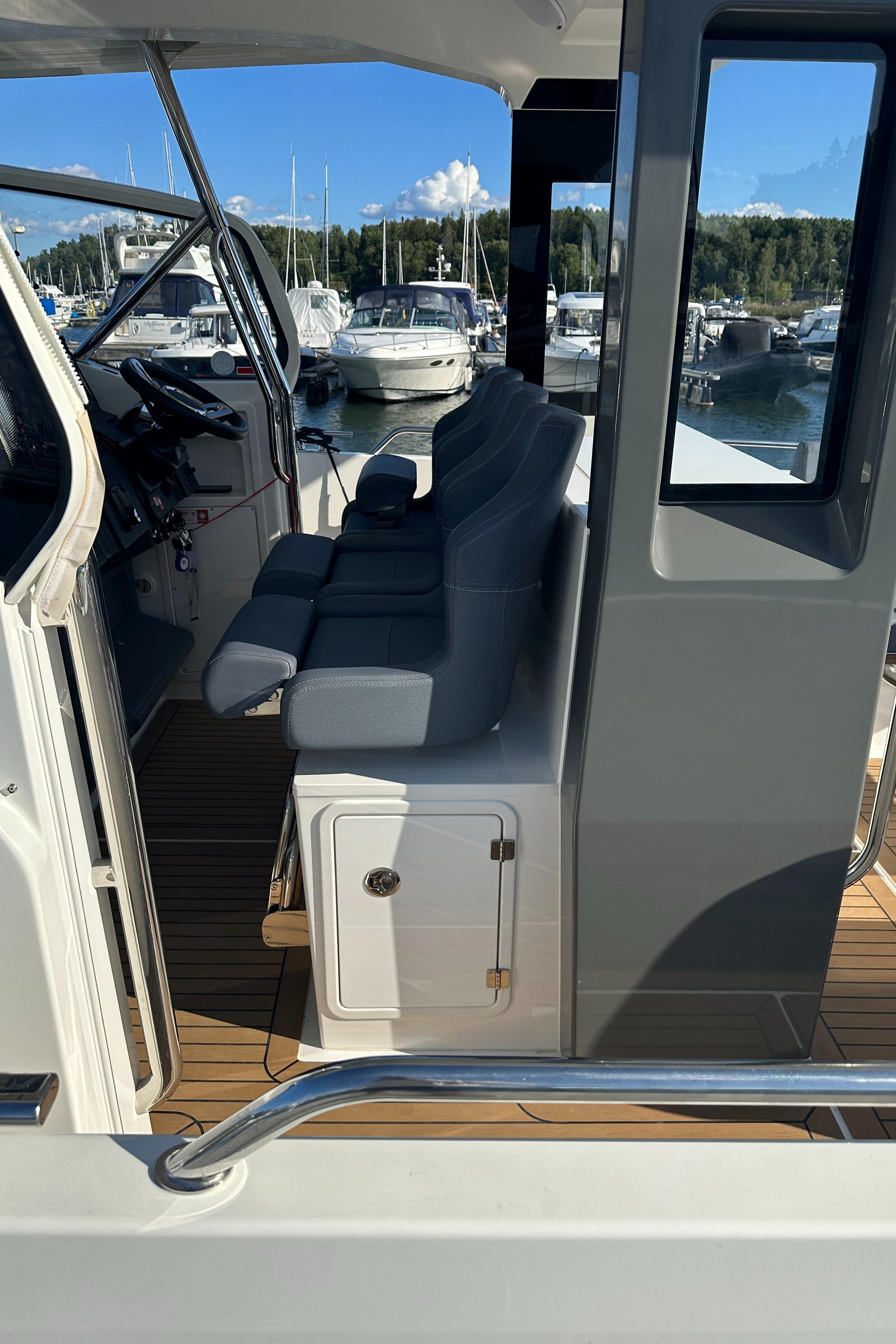 2021 Nimbus Tender 11 boat interior with seating, docked at marina.