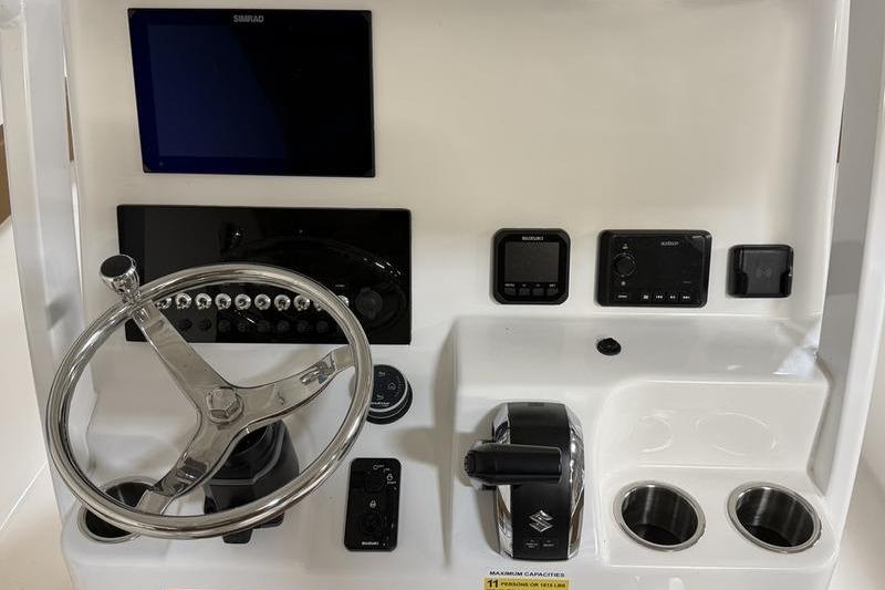 2026 Sea Pro 242 Center Console dashboard with steering wheel and controls.