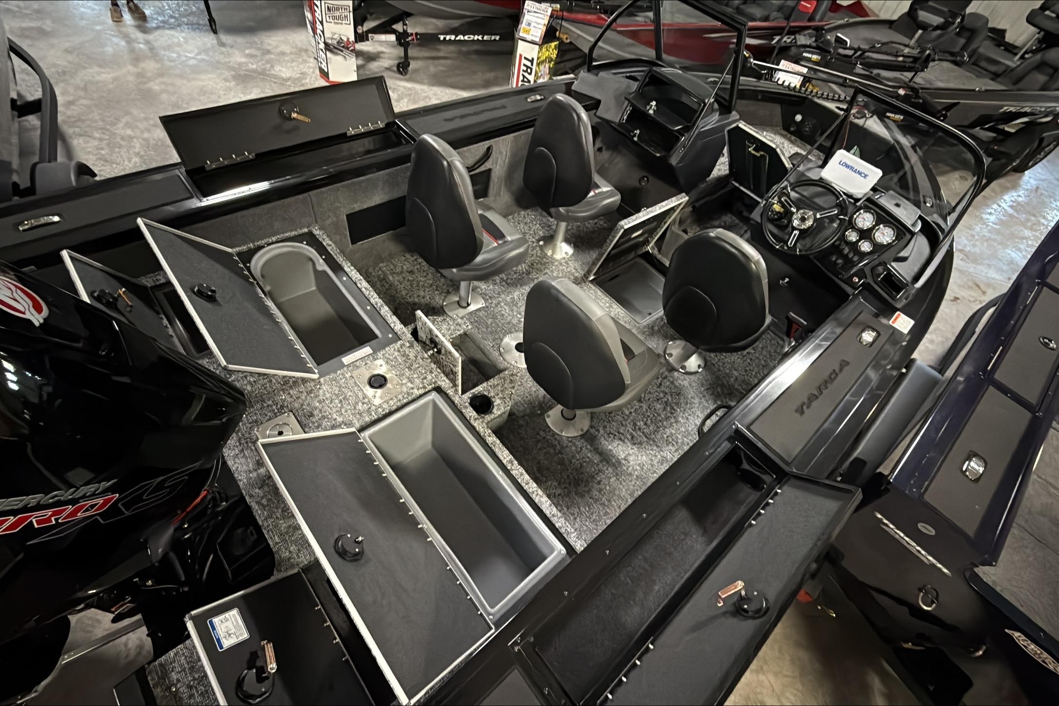 2026 Tracker Targa V-18 WT boat interior with seating, storage compartments, and control panel.