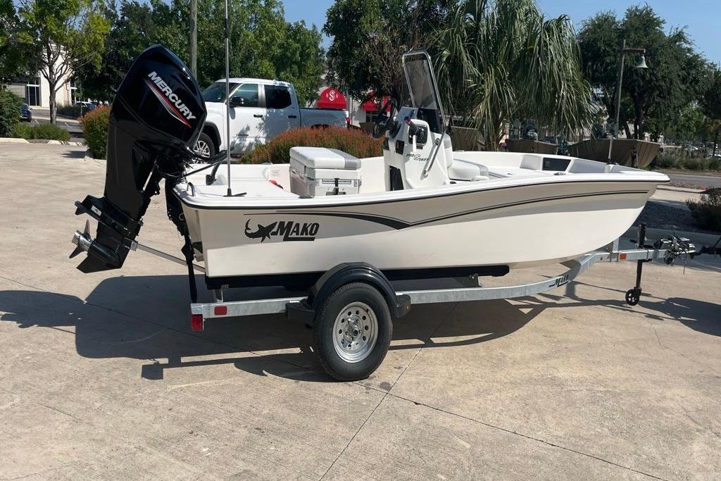2026 Mako Pro Skiff 15 CC boat on trailer with Mercury outboard motor.