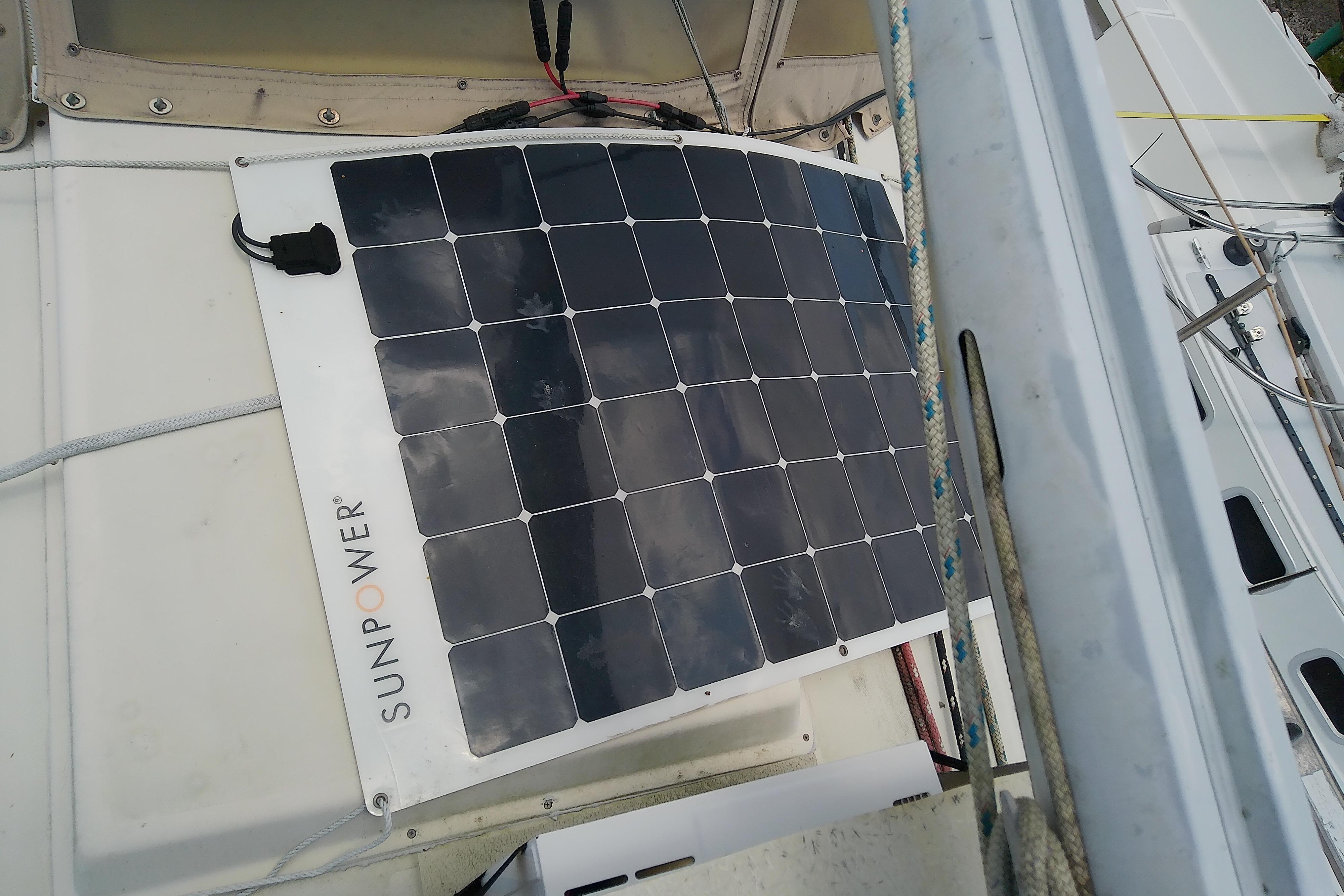 Solar panel on 1981 Sea Sprite 34 sailboat deck, enhancing energy efficiency.