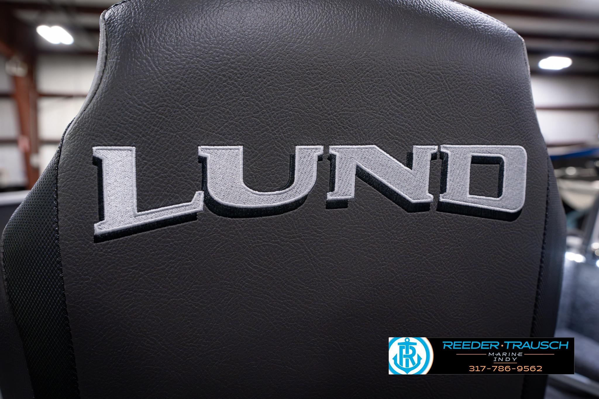 2026 Lund 1650 Rebel XL SS boat seat with embroidered logo in showroom.