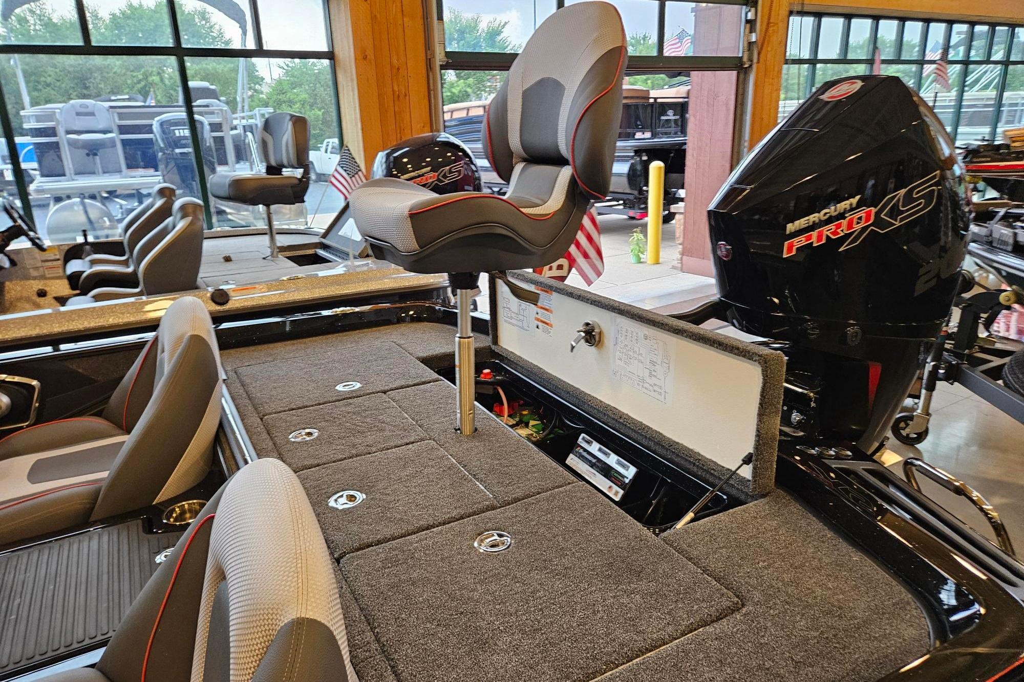 2026 Ranger Z518 Cup-Equipped boat interior with Mercury Pro XS engine in showroom.