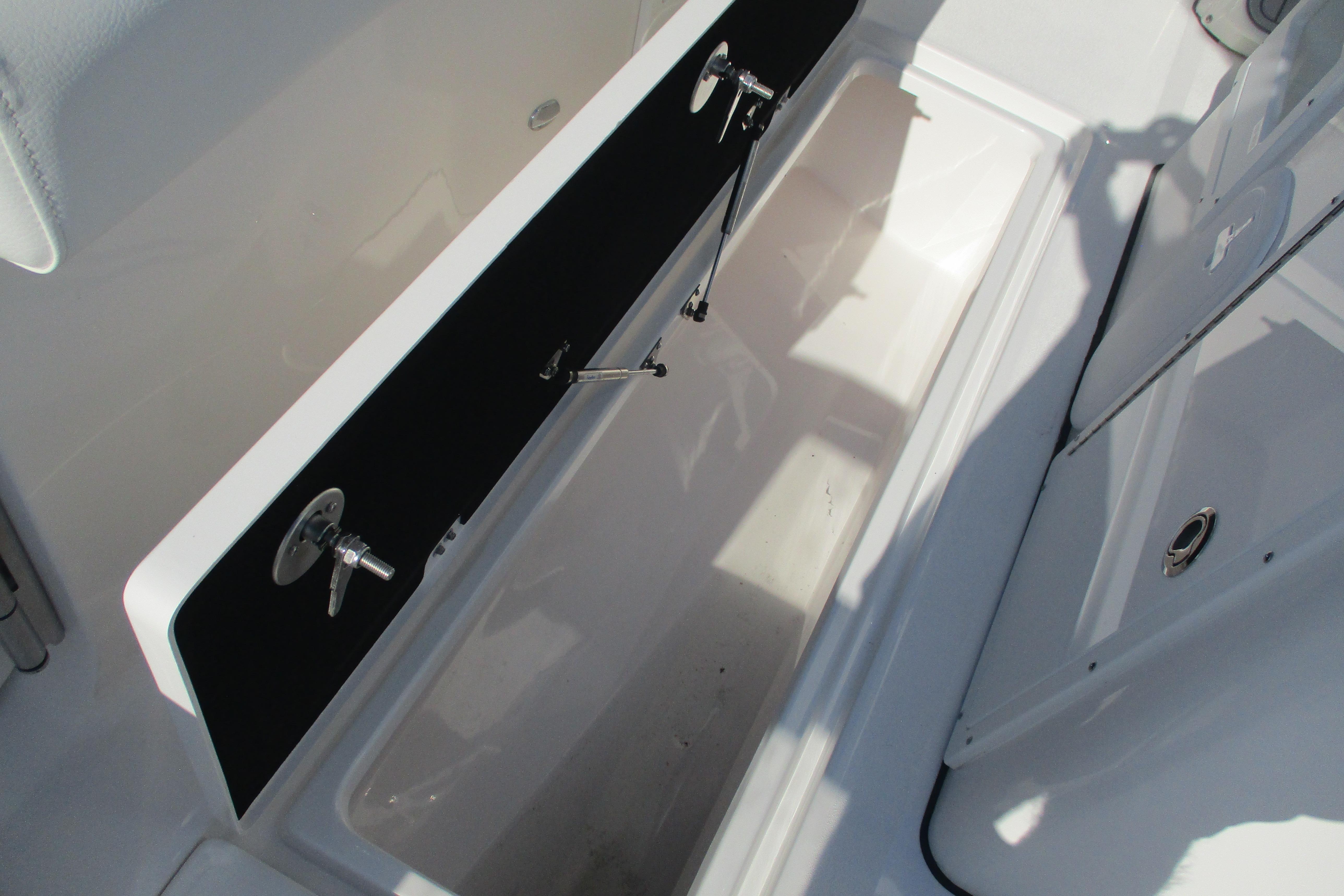 Storage compartment on 2026 Sea Fox 328 Commander boat, featuring sleek design and secure latches.