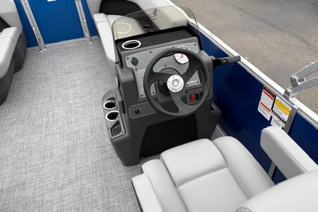 2026 Sun Tracker Party Barge 16 DLX interior with steering console and seating.