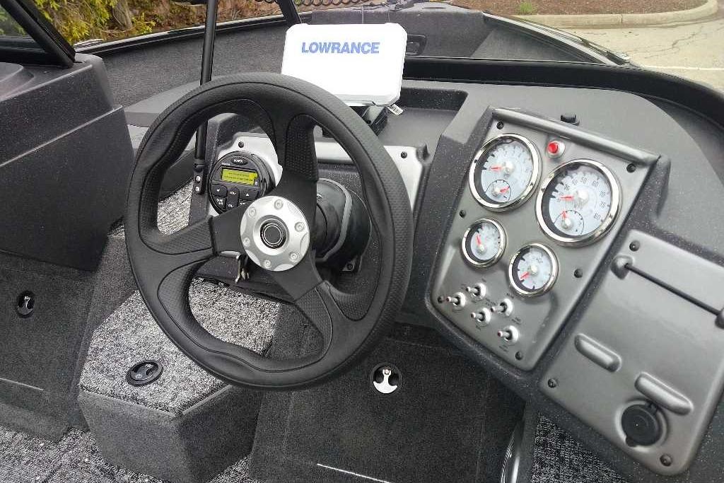 2026 Tracker Pro Guide V-175 Combo dashboard with steering wheel, gauges, and Lowrance display.