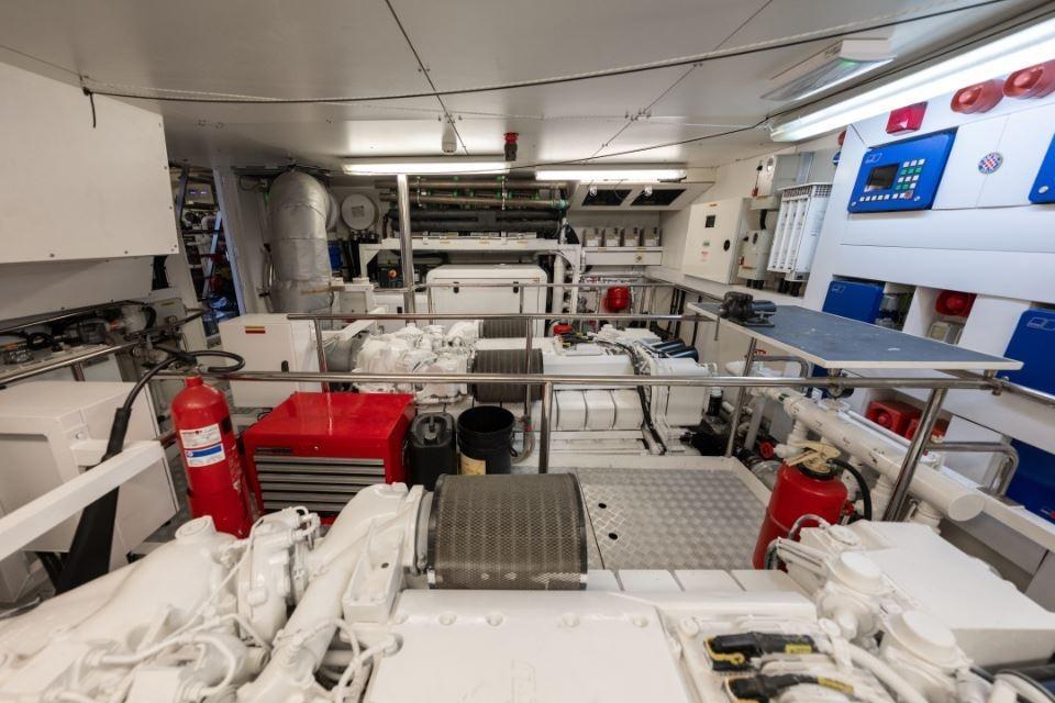 Engine room of a 2009 Sunseeker 34 Metre Yacht, featuring machinery and safety equipment.