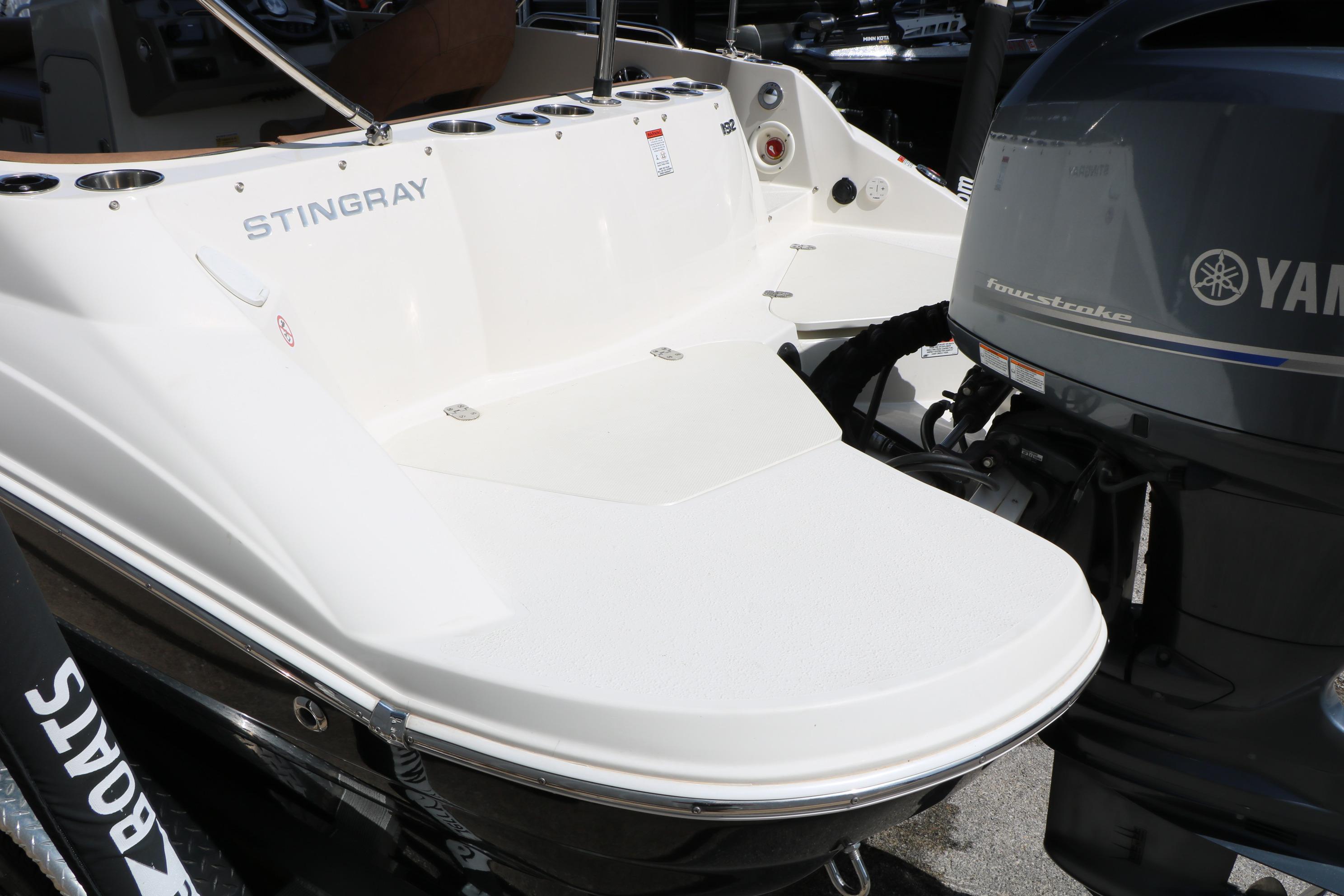 2022 Stingray 192 SC boat with Yamaha outboard motor, rear view.