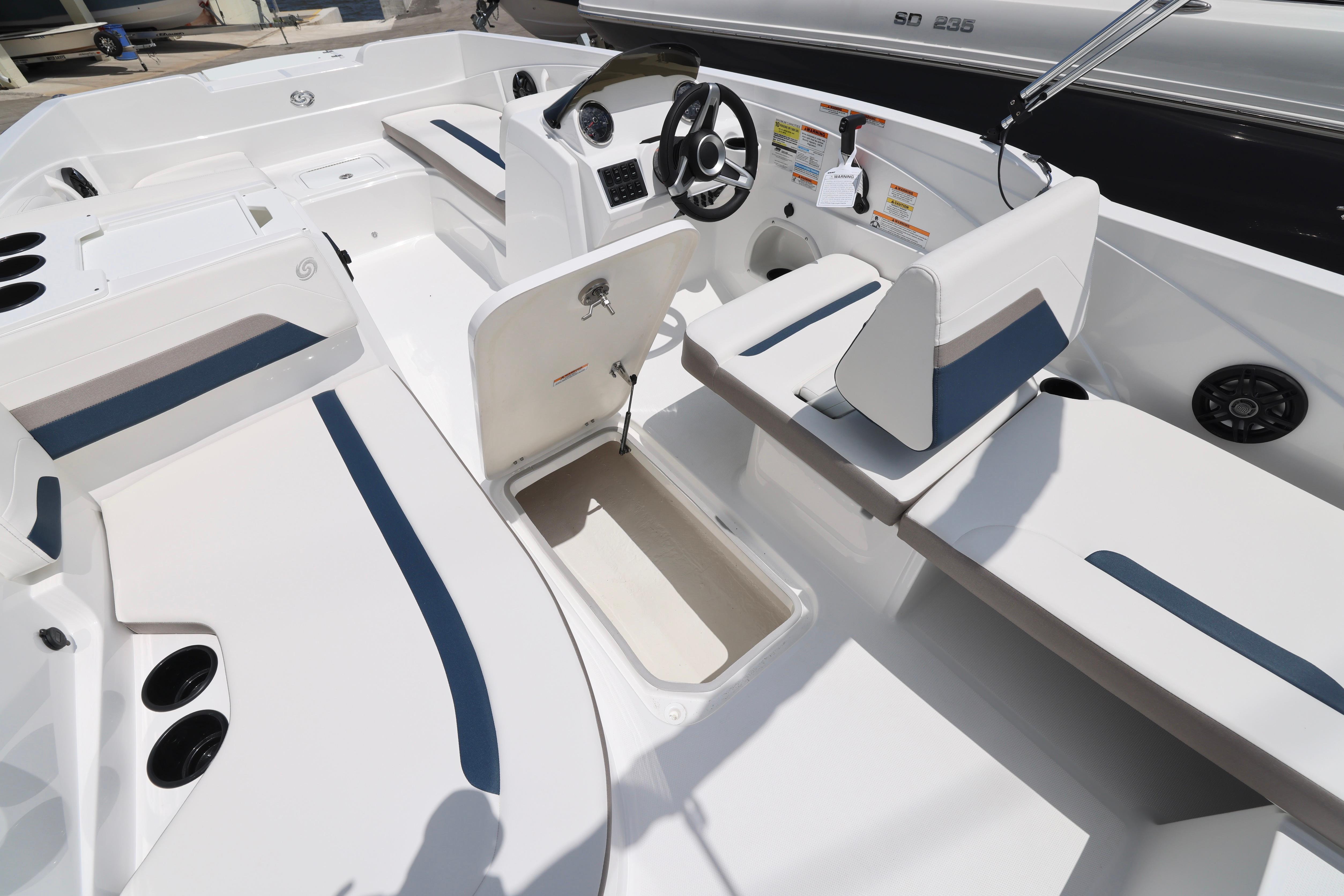 2026 Hurricane SunDeck Sport 205 OB interior with seating and storage compartments.