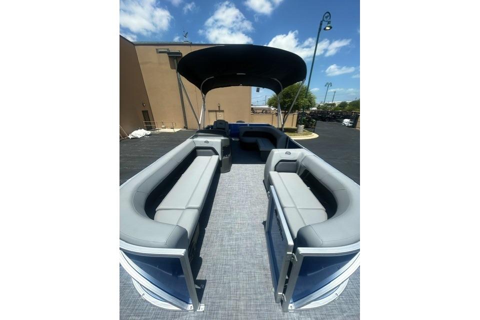 2026 Sun Tracker Party Barge 18 DLX pontoon boat with spacious seating and canopy.