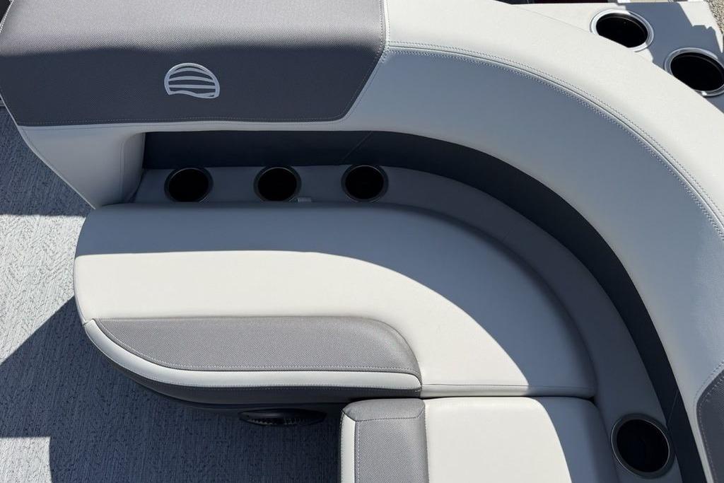 2026 Sun Tracker Bass Buggy 18 DLX boat seating with cup holders, featuring gray upholstery.