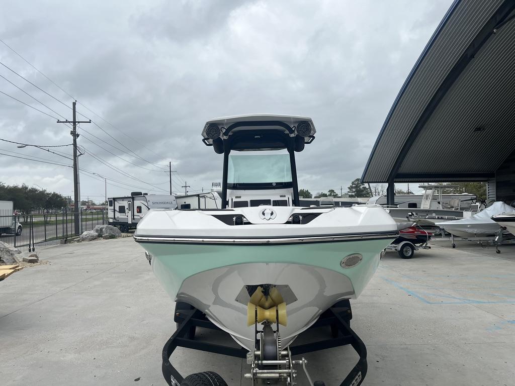 2022 Scarab 255 Open ID boat on trailer in outdoor storage area.