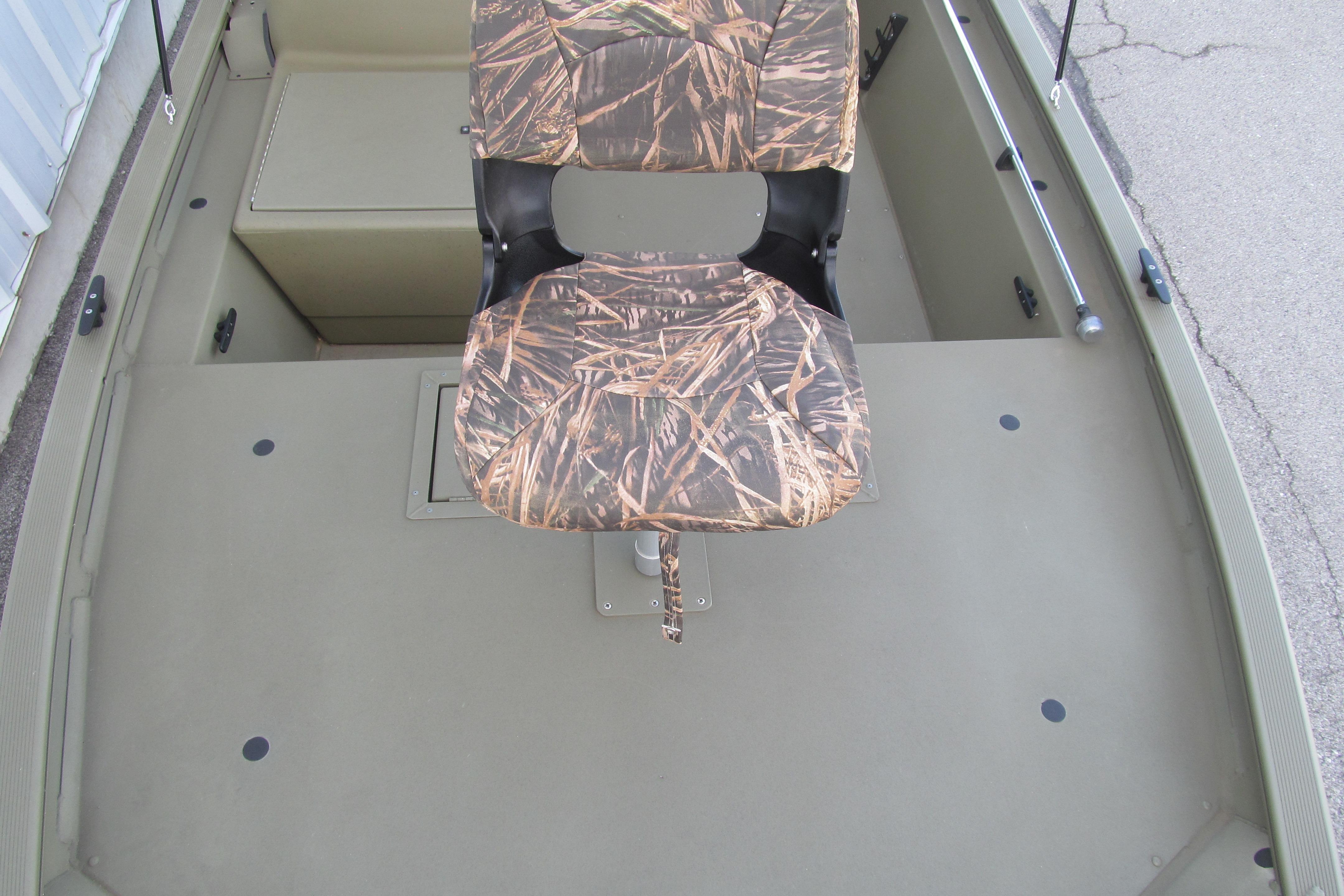 2018 Tracker Grizzly 1754 SC boat interior with camo seat and storage compartments.