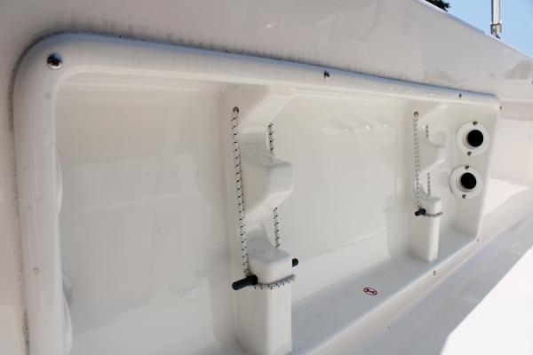 2023 Sundance DX20 boat interior detail, showcasing storage compartments and fixtures.