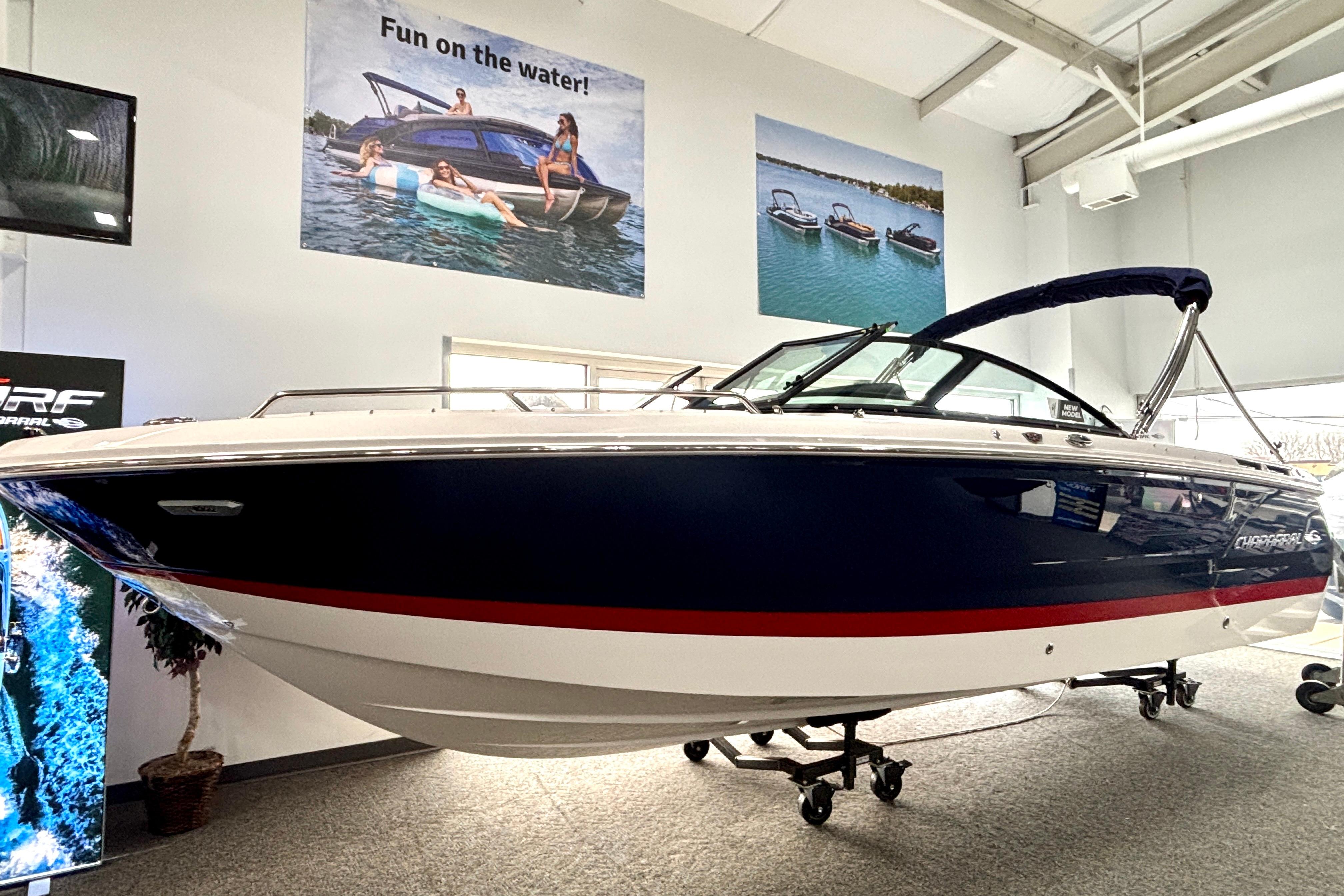 2026 Chaparral SSX 4 boat displayed indoors, featuring sleek design and vibrant colors.