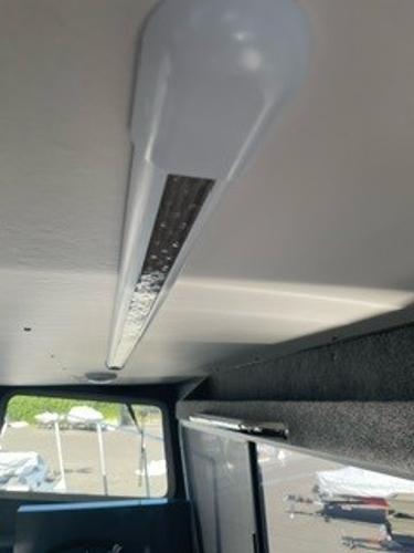 Interior view of a 2025 Spartan 2600 Olympia, featuring a ceiling light fixture.
