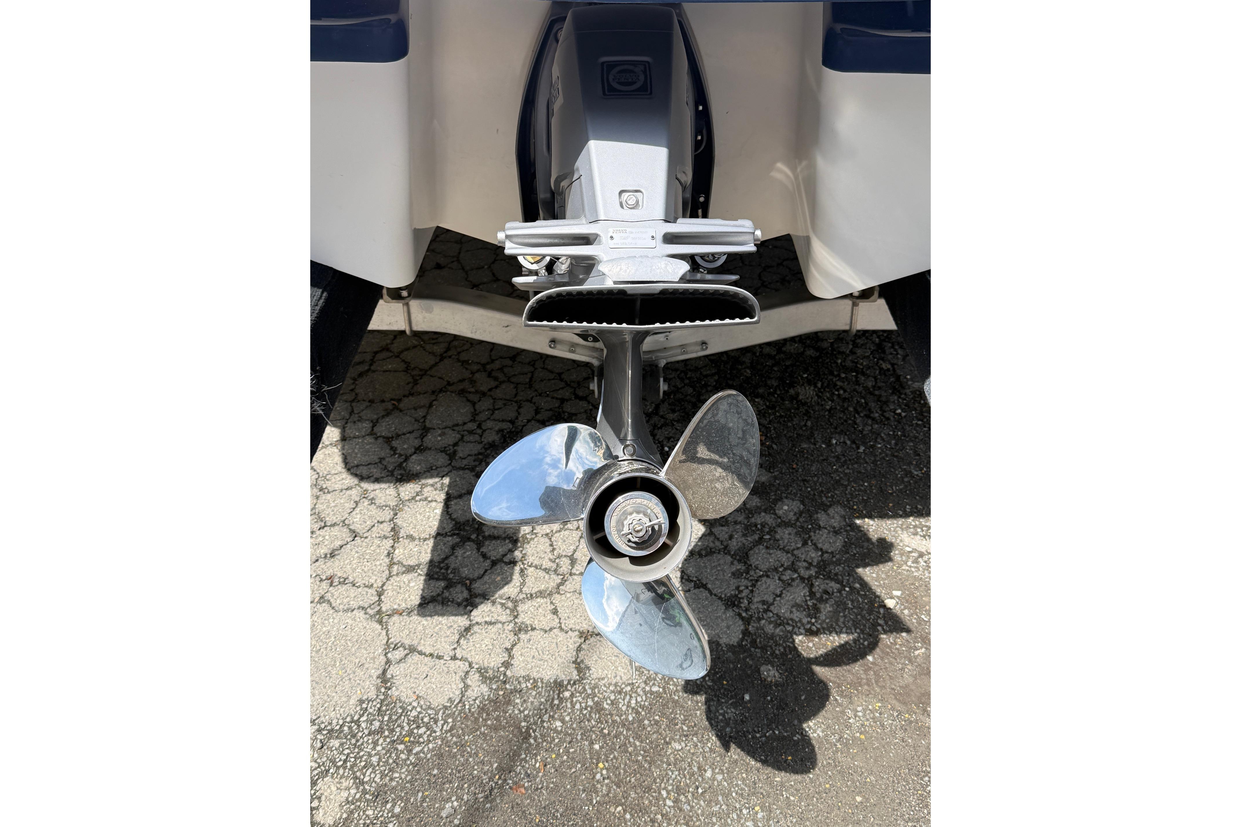 2016 Chaparral 226 SSi Wide Tech boat propeller on pavement background.
