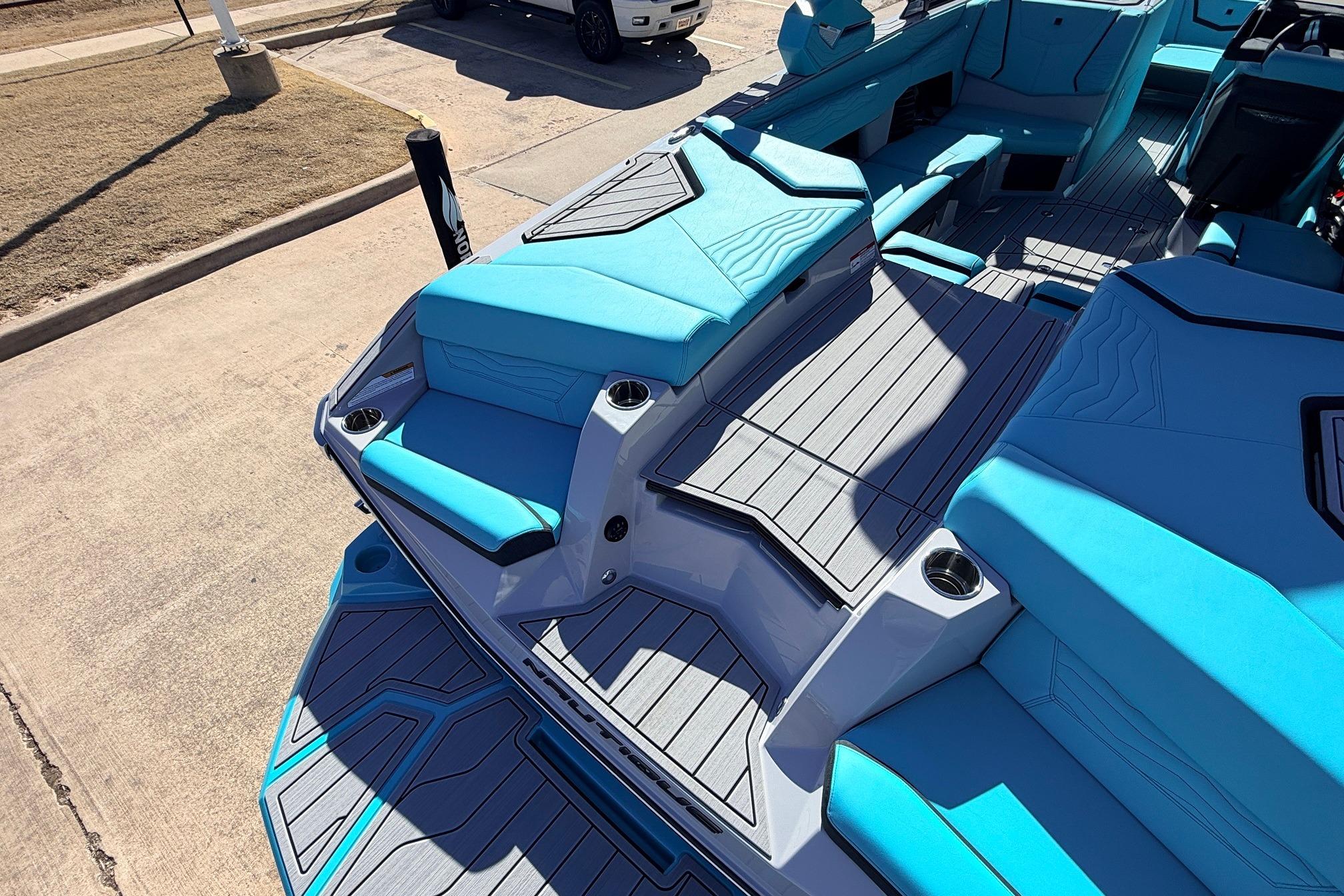 2026 Nautique Super Air Nautique G23 boat interior with blue seating and sleek design.