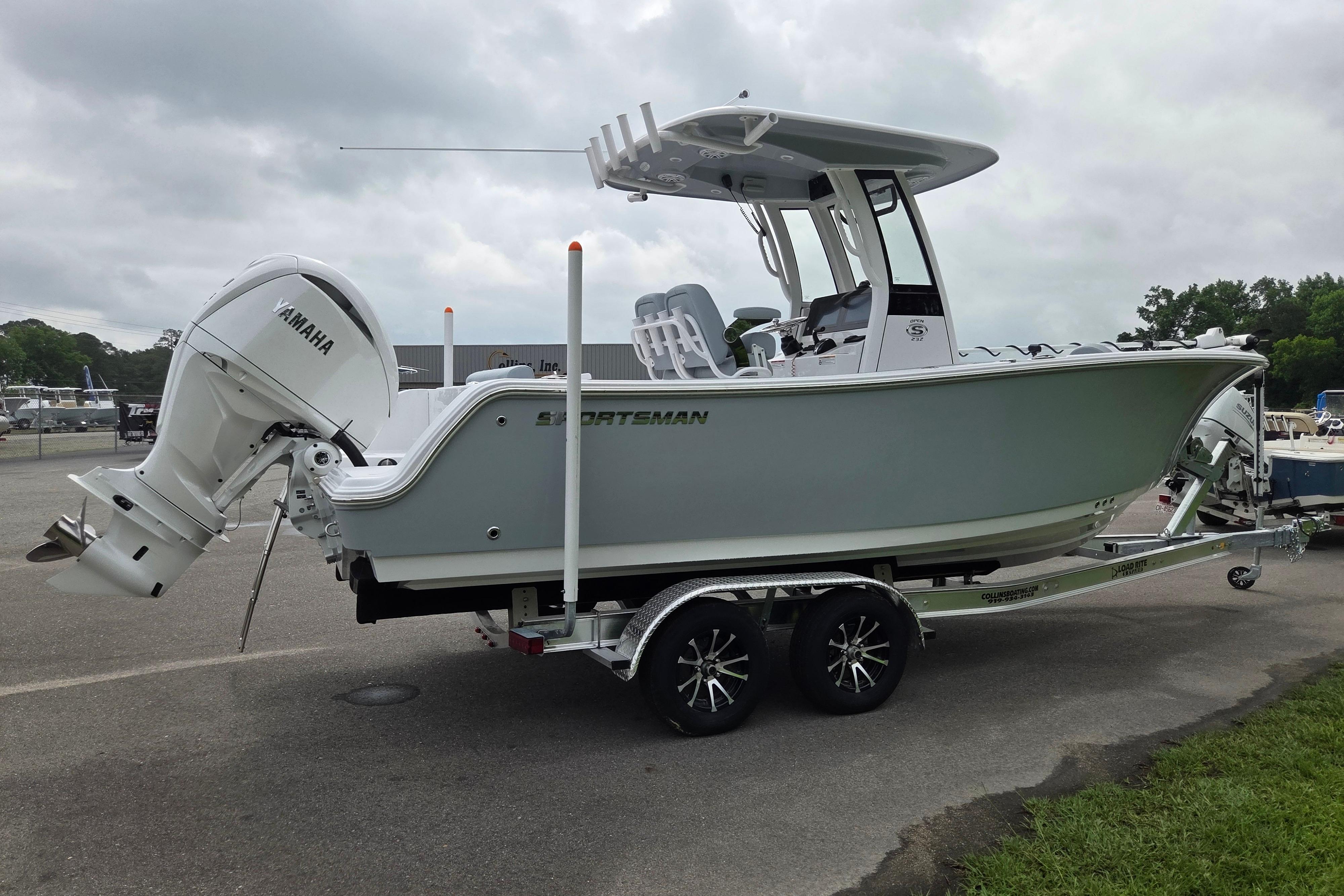 2026 Sportsman Open 232 Center Console boat on trailer, featuring Yamaha outboard motor.