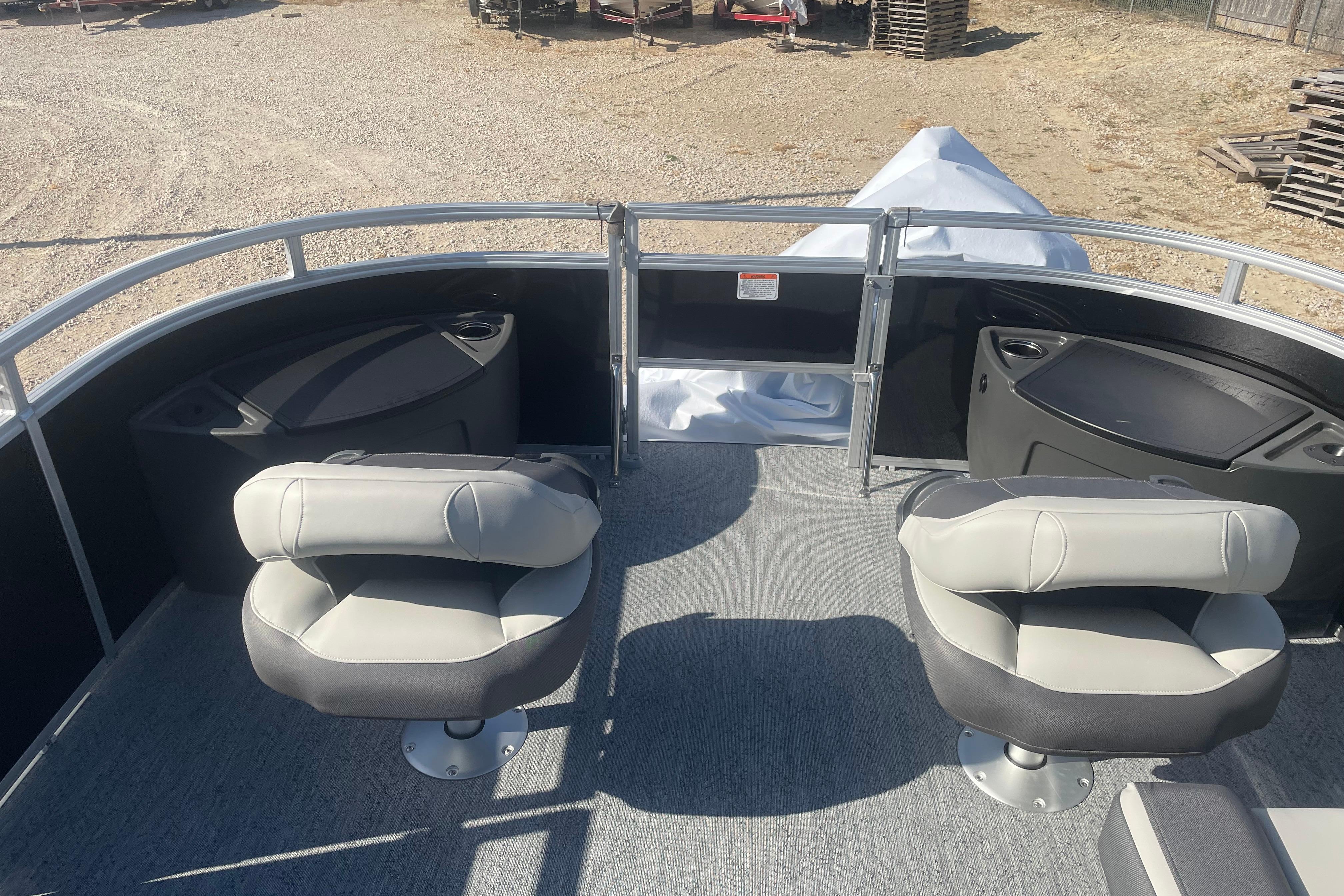 2026 Sun Tracker Fishin' Barge 20 DLX with comfortable seating and spacious deck.