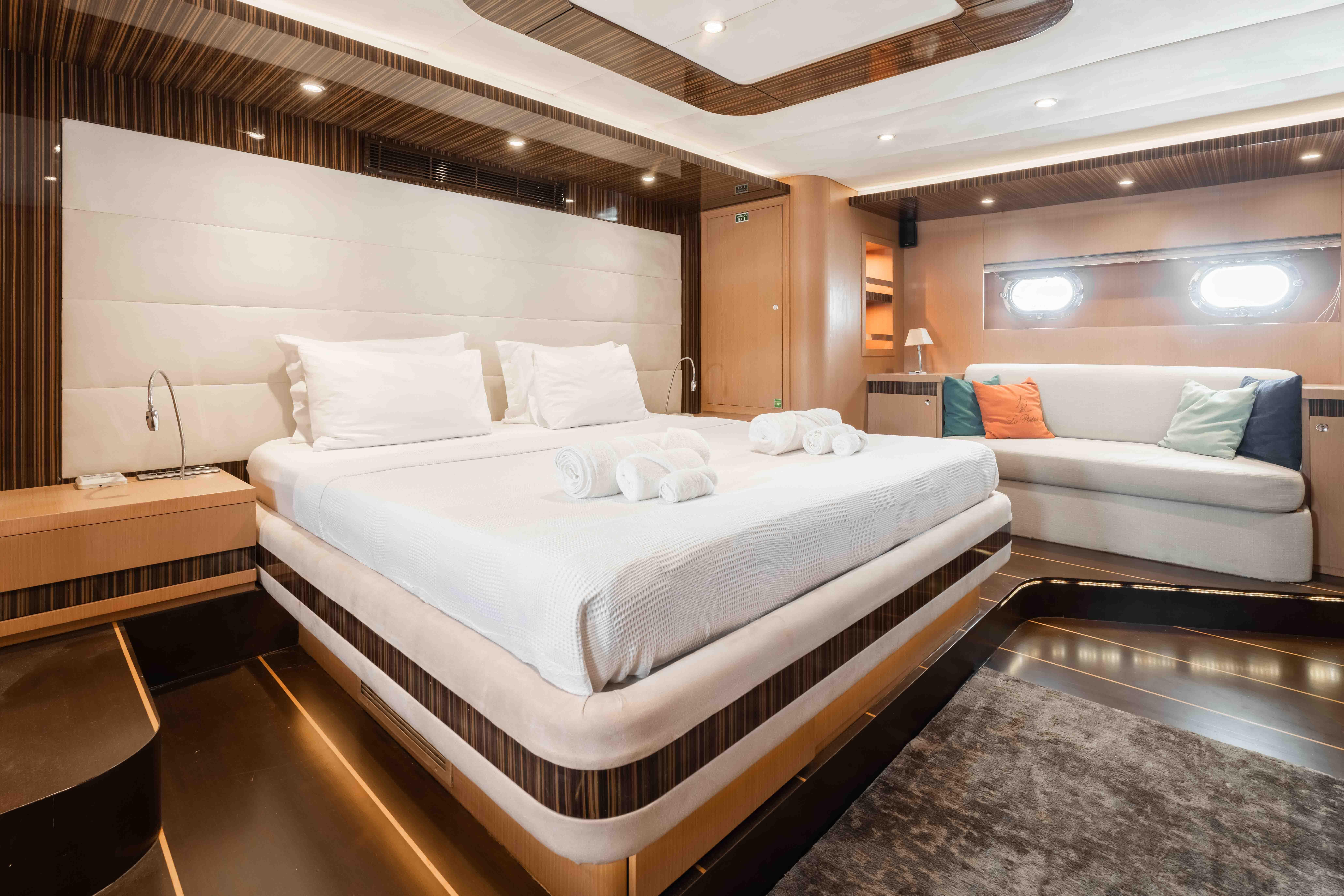 Luxurious bedroom interior of a 2009 custom sailing yacht with modern design.