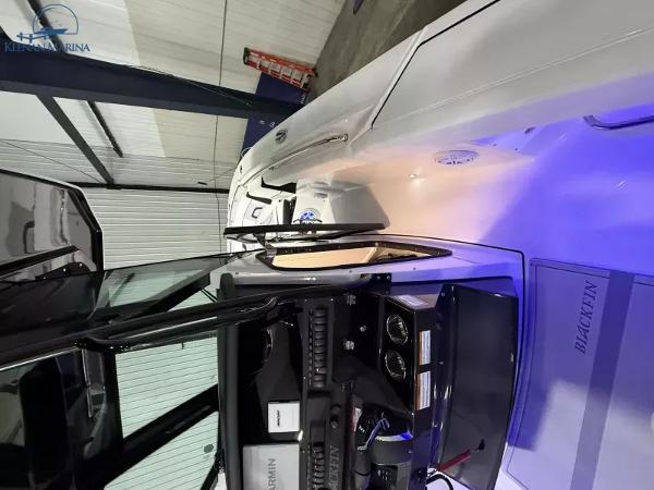 2025 Blackfin 272CC boat interior with illuminated dashboard and sleek design.