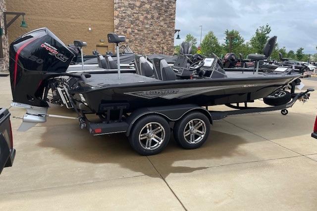 2025 Ranger ALPHA 208 boat with dual axle trailer, parked outdoors.
