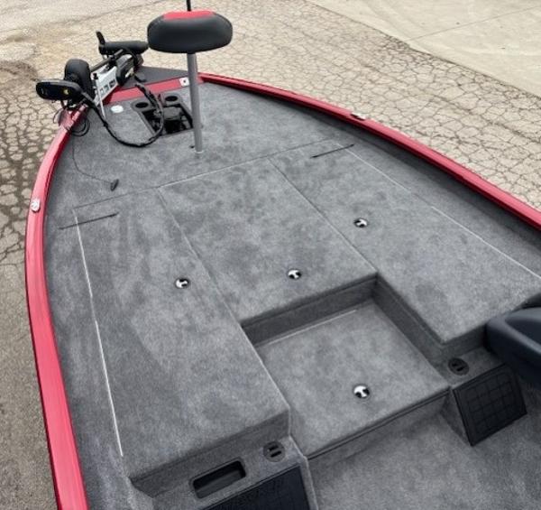 2025 Tracker Savage 215 boat deck with gray carpet and red trim.