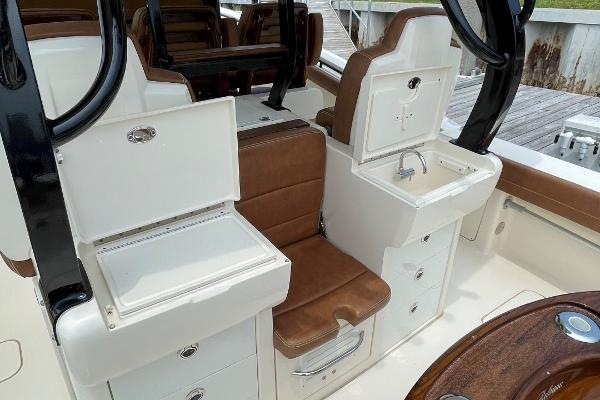 2020 Scout 420 LXF boat interior with seating, storage, and sink.