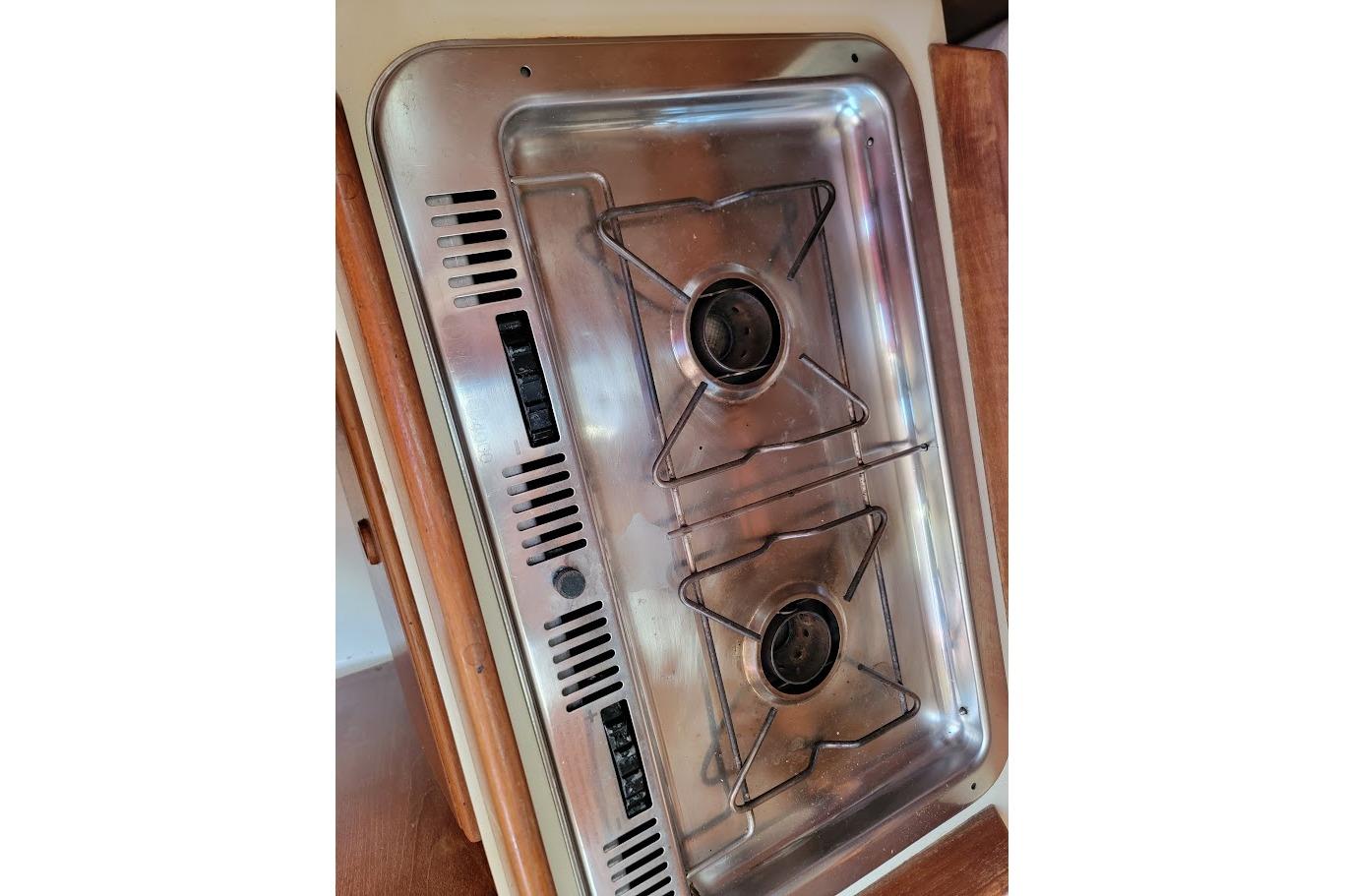 Stainless steel two-burner stove on a 1986 Pearson 28 sailboat.