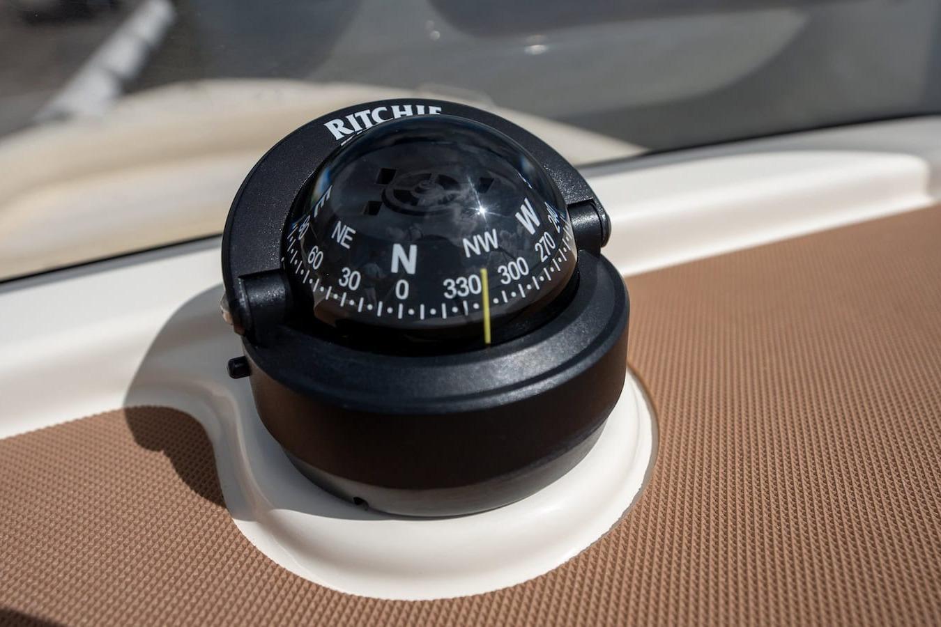 Compass on 2026 Scout 188 Sportfish boat dashboard, displaying cardinal directions.