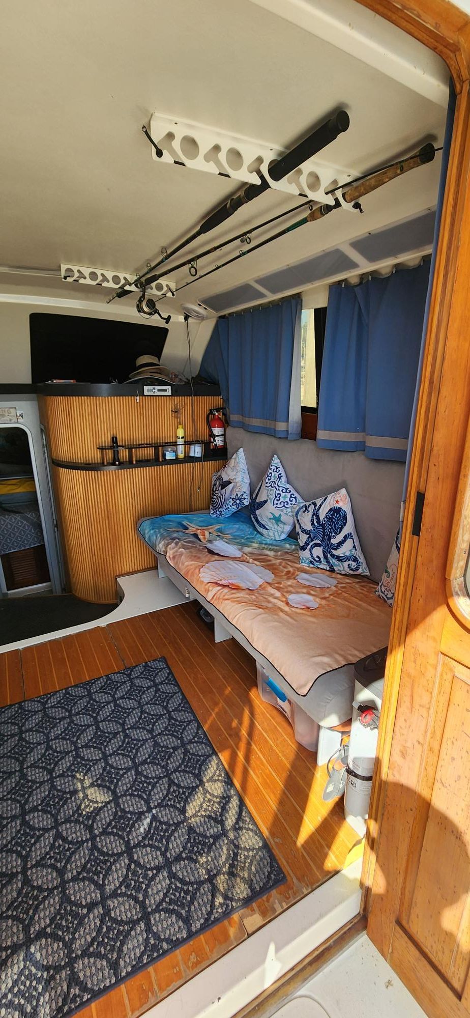 Interior of a 1990 Luhrs 320 yacht with cozy seating area.