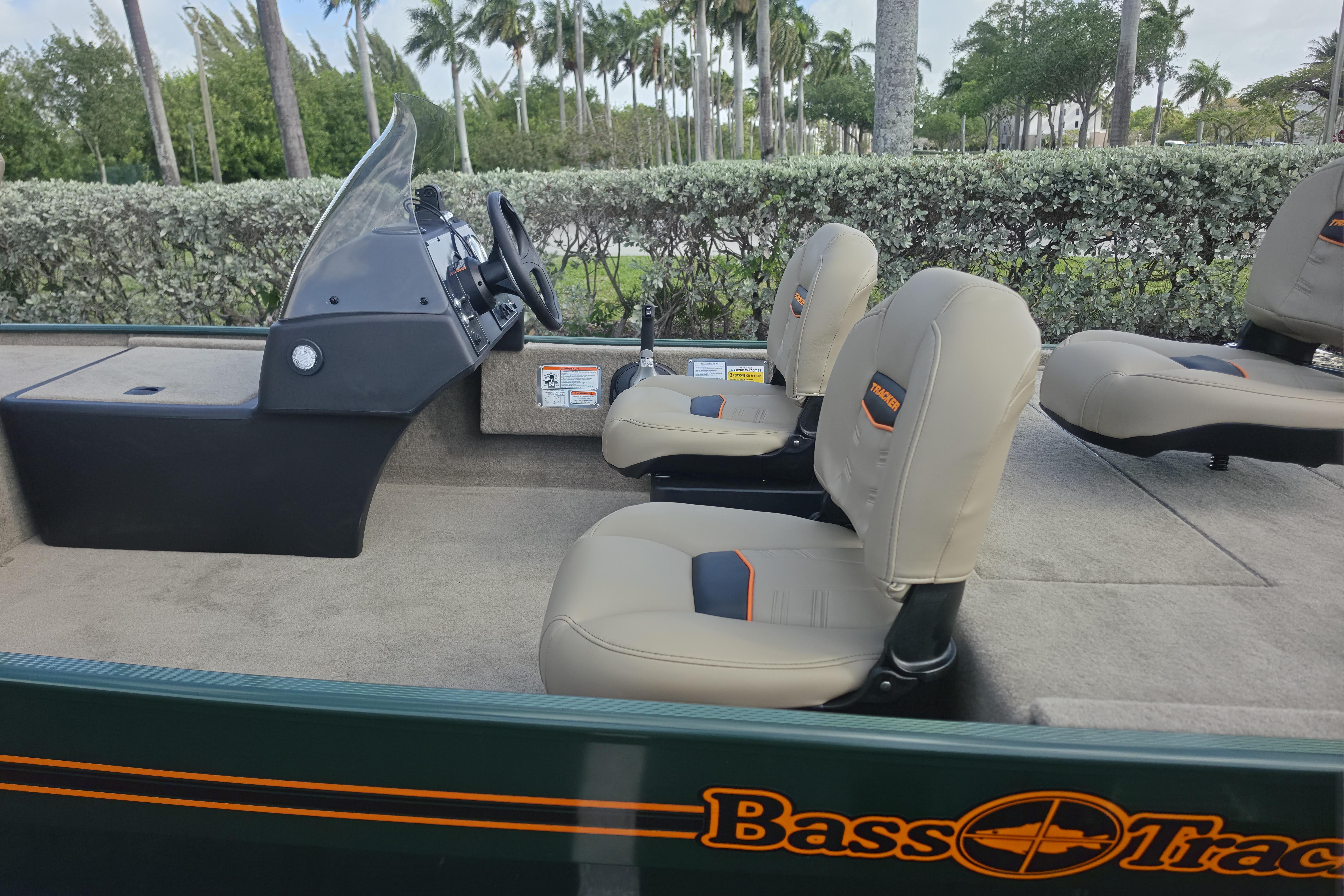 2026 Tracker Bass Tracker Classic Limited boat interior with beige seats and steering console.