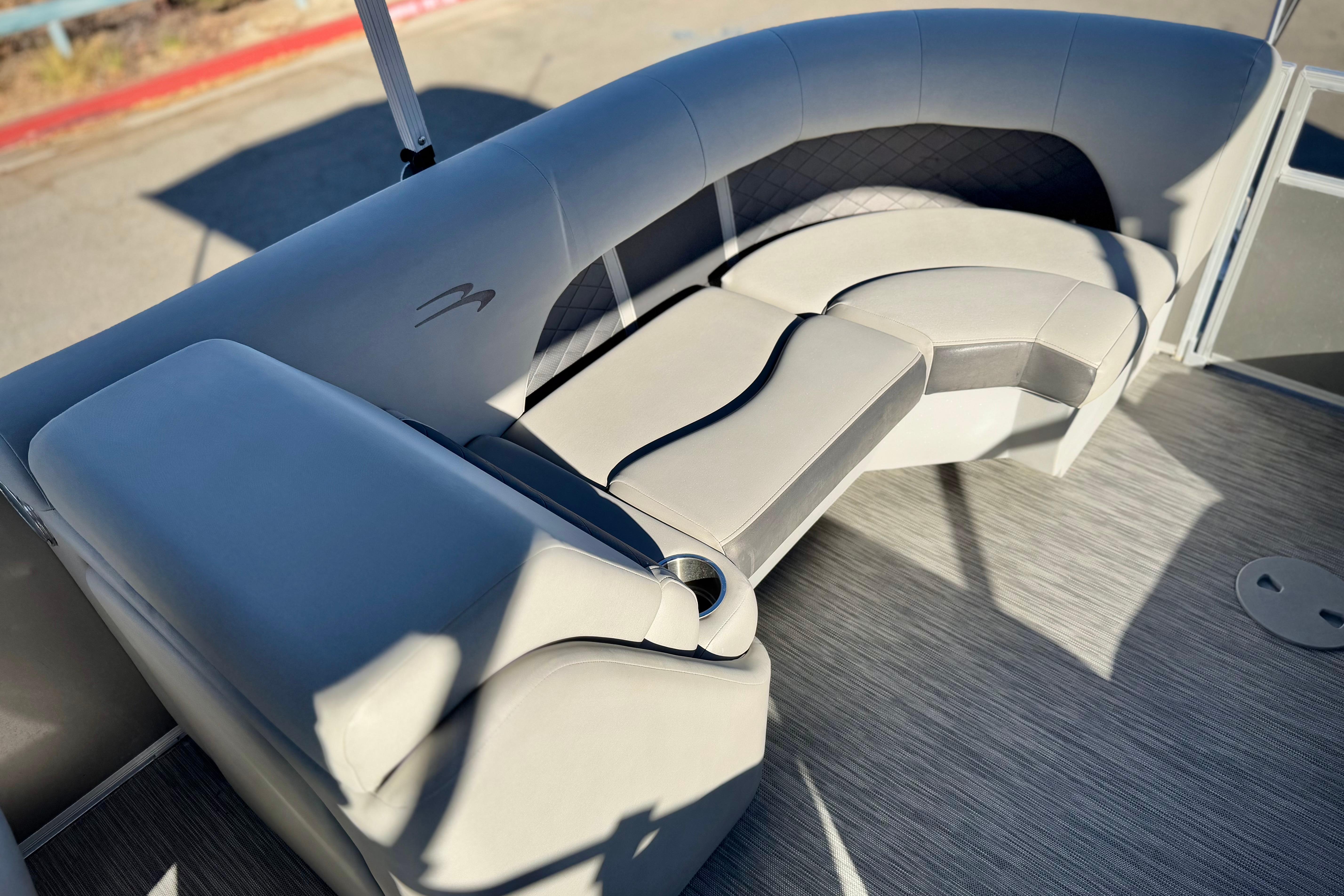 Luxurious seating on a 2021 Bennington 23LSR pontoon boat, featuring elegant upholstery and design.