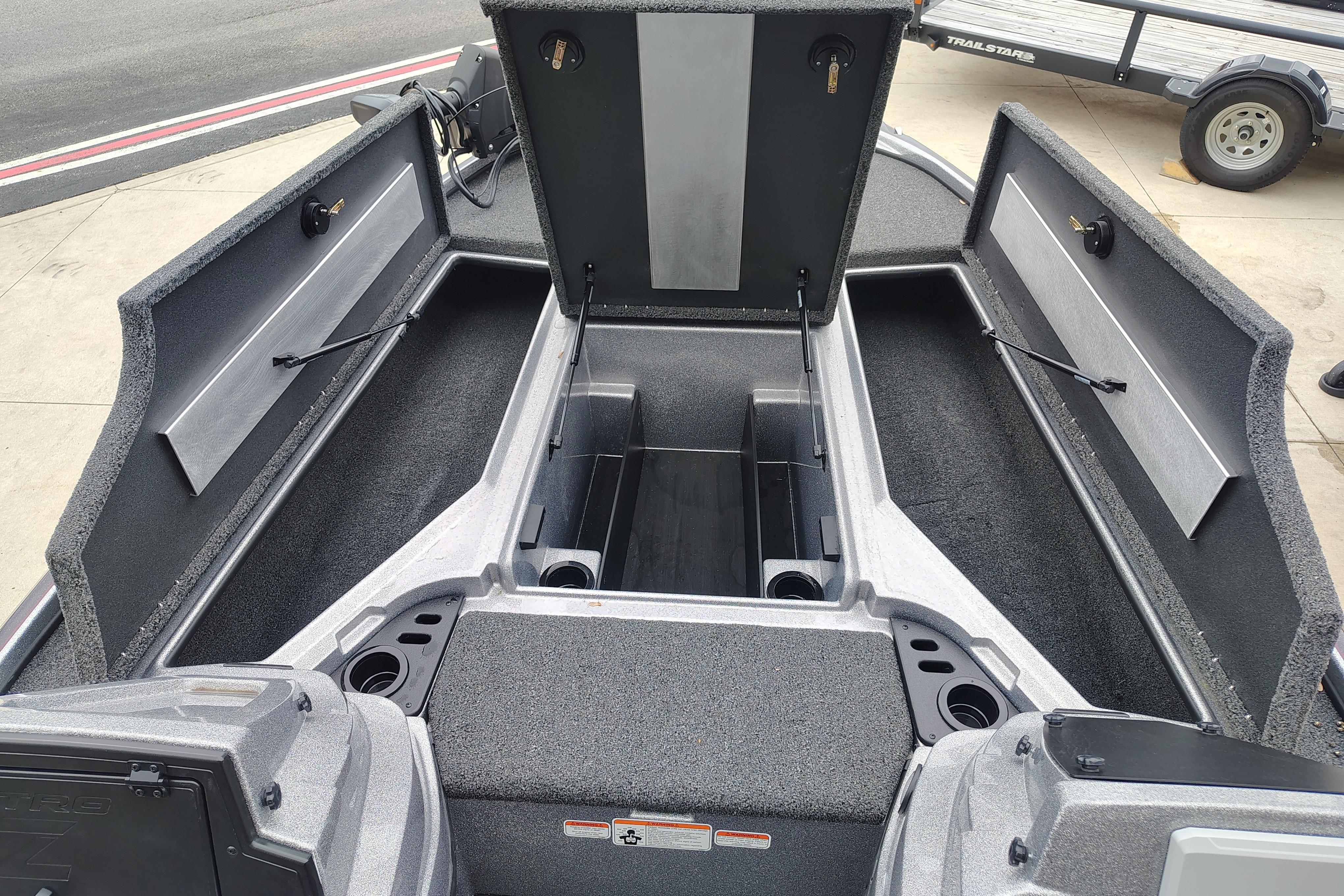 Open storage compartments on a 2026 Nitro Z18 Pro boat, showcasing spacious interior design.