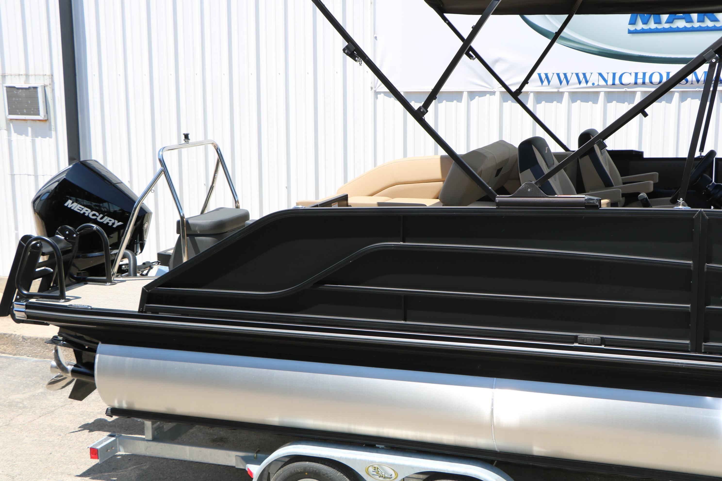 2026 Evotti 521CS pontoon boat with Mercury engine, displayed on a trailer.