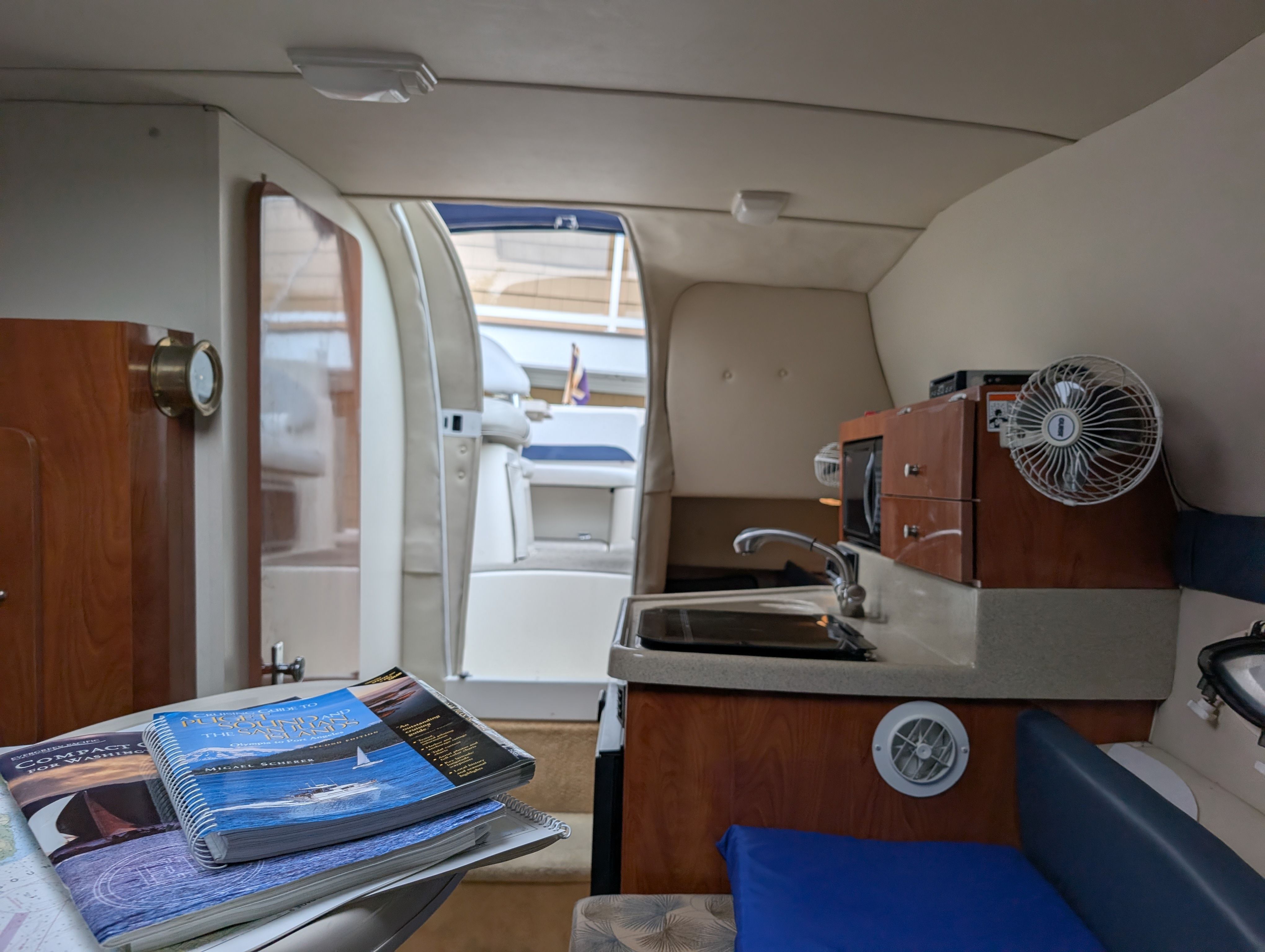 Interior of a 2006 Glastron GS yacht with kitchenette and seating area.
