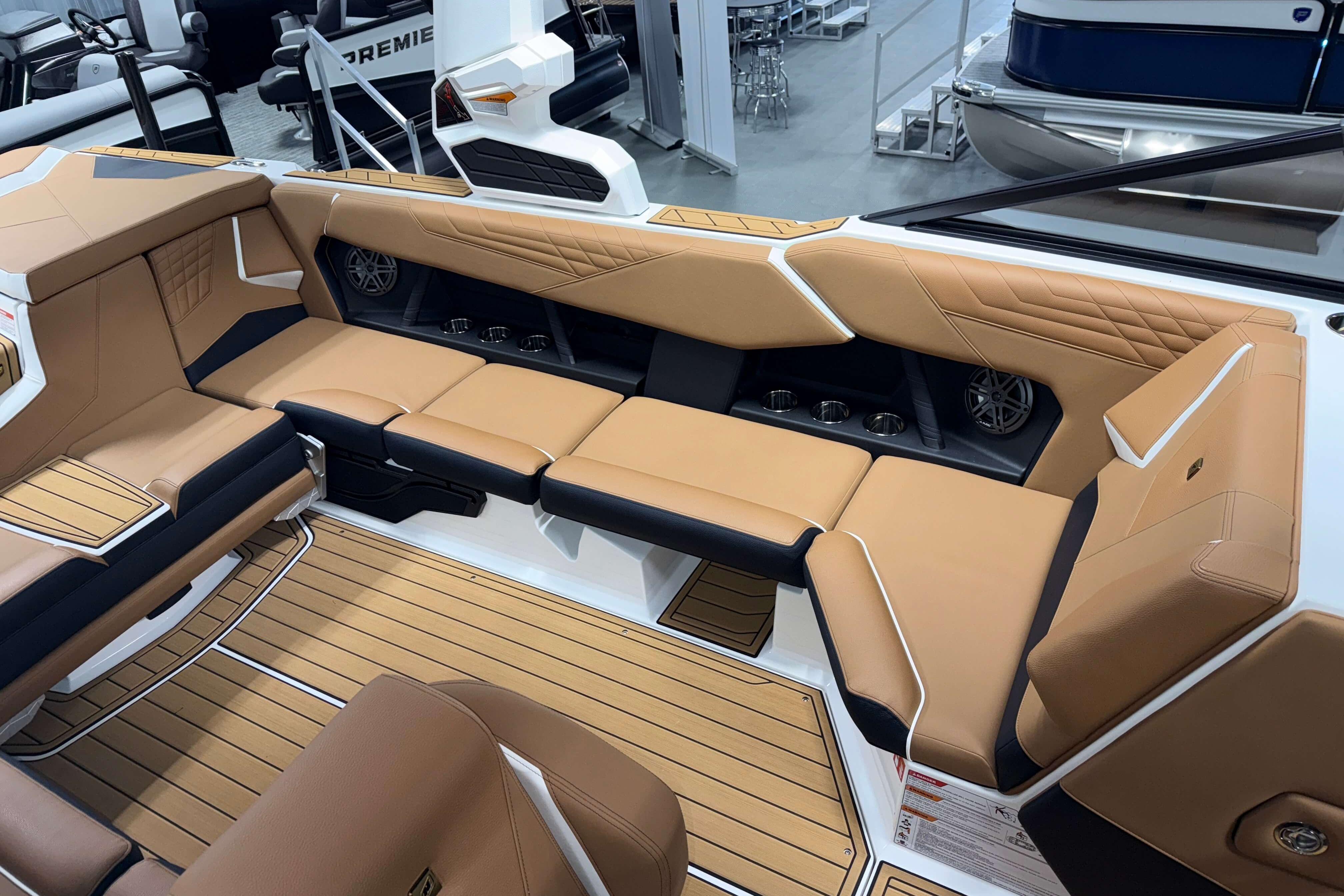 Luxurious interior of 2026 Nautique Super Air Nautique S23 with tan seating and modern design.