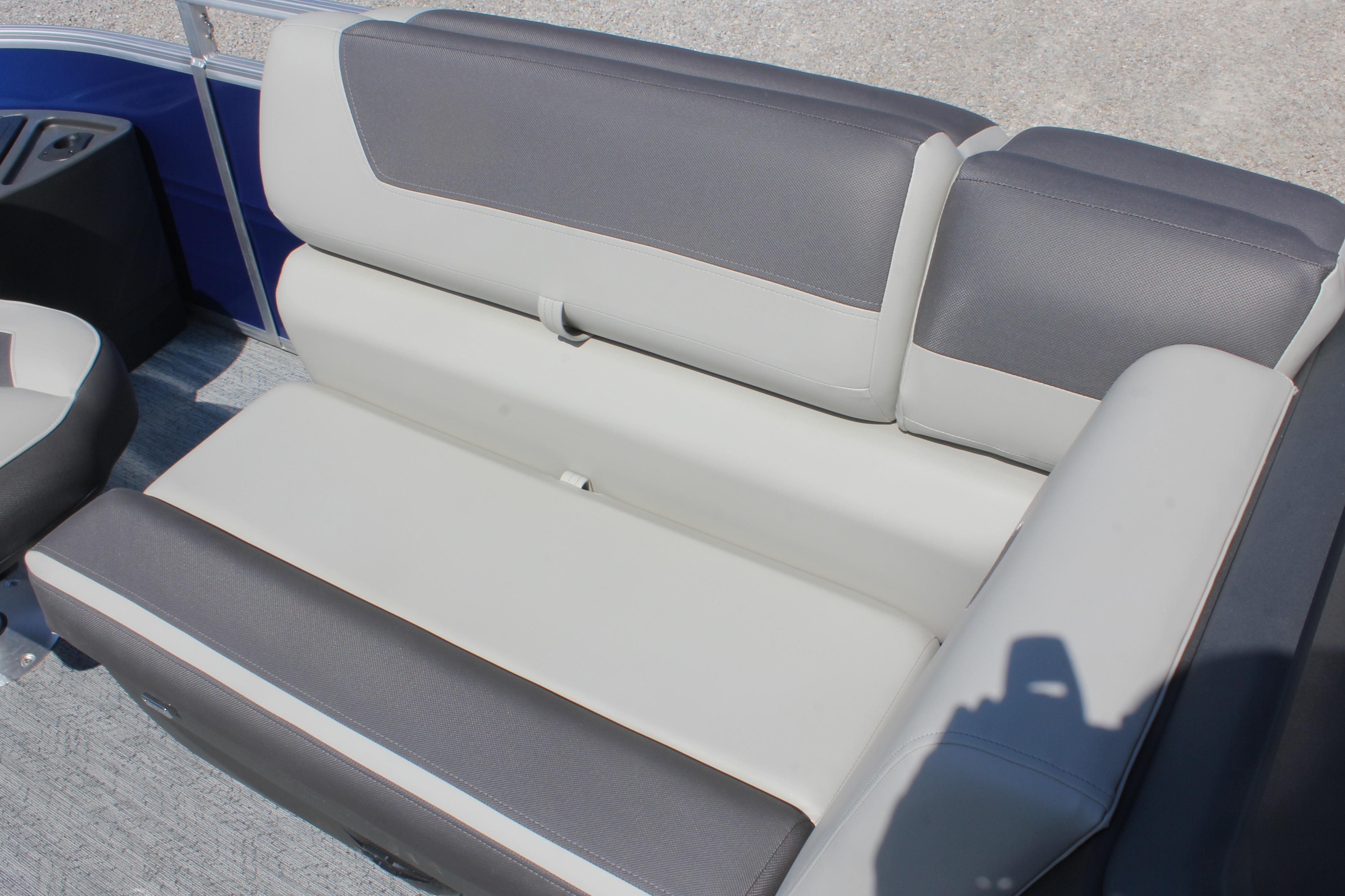 2026 Sun Tracker Fishin' Barge 20 DLX boat seating, gray and white upholstery.