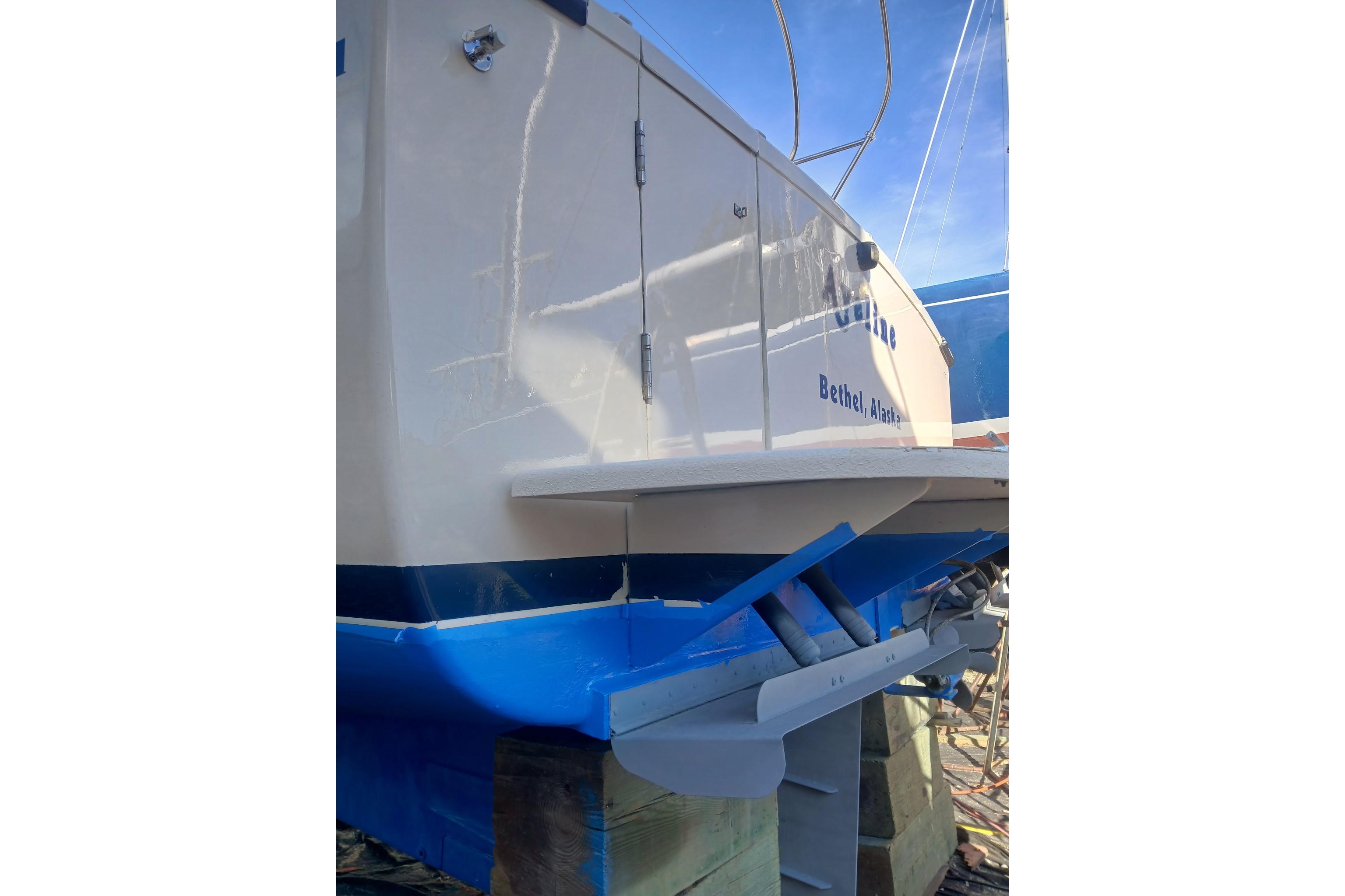 1997 Rosborough Trawler boat docked, featuring a blue and white hull, Bethel, Alaska.