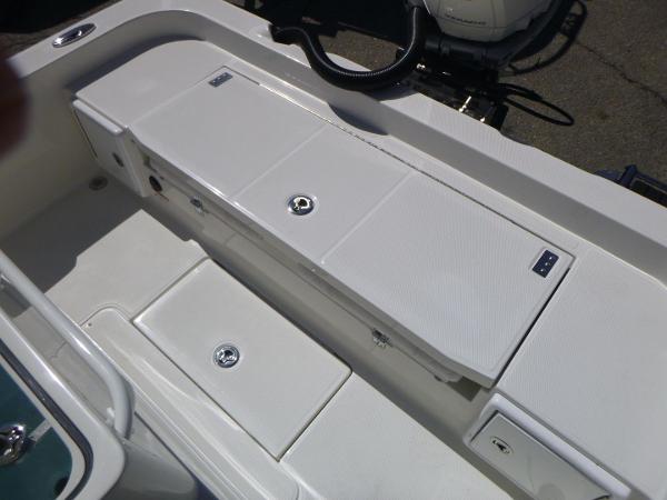 2024 Ranger 2360 Bay boat interior with storage compartments and sleek design.