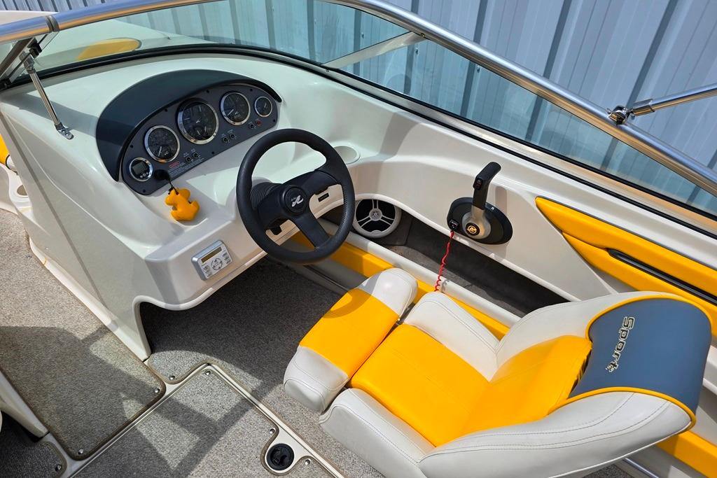 Interior of a 2007 Sea Ray 205 Sport boat with yellow and white seating.