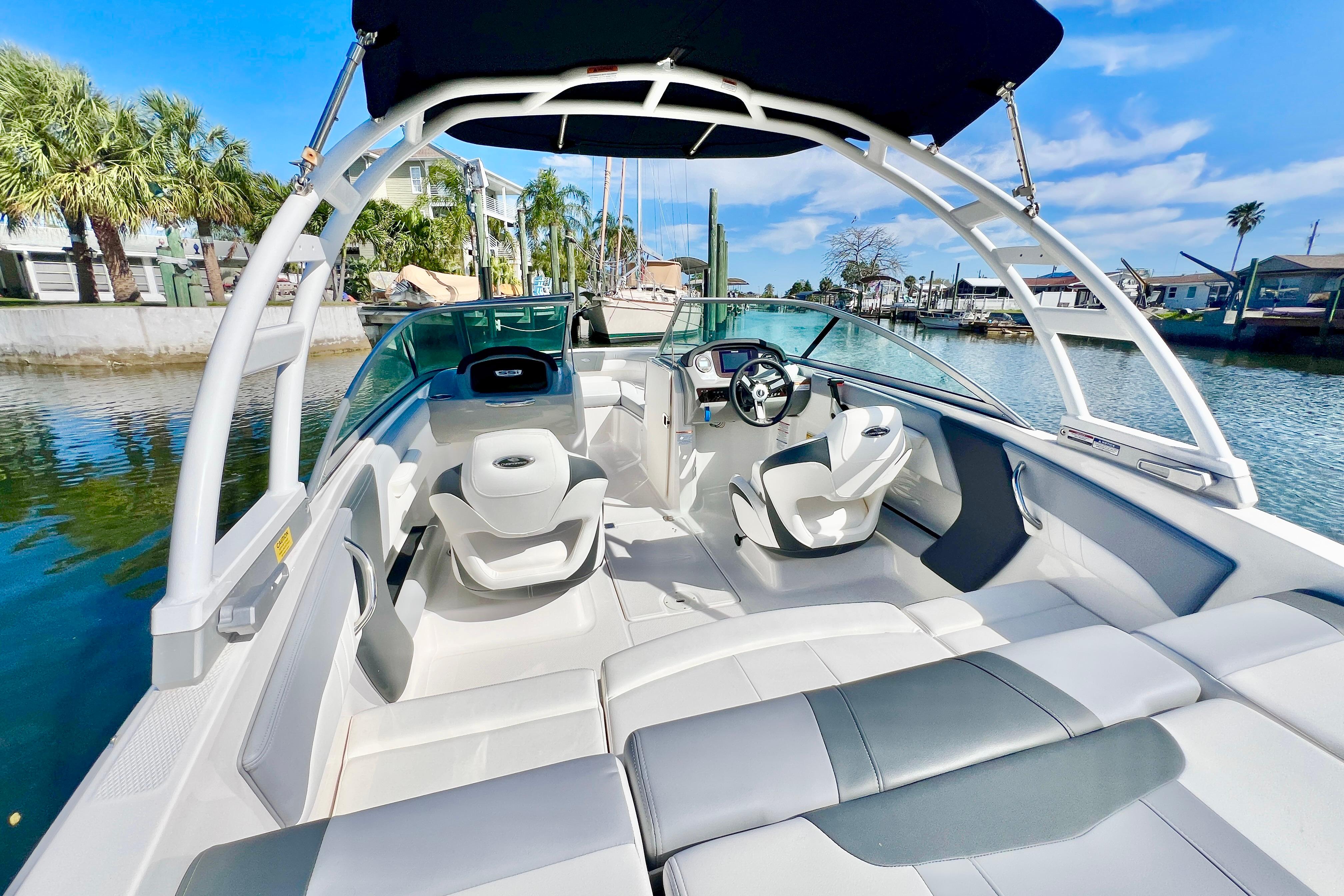 2023 Chaparral 21 SSi OB boat interior with sleek seating and modern dashboard.