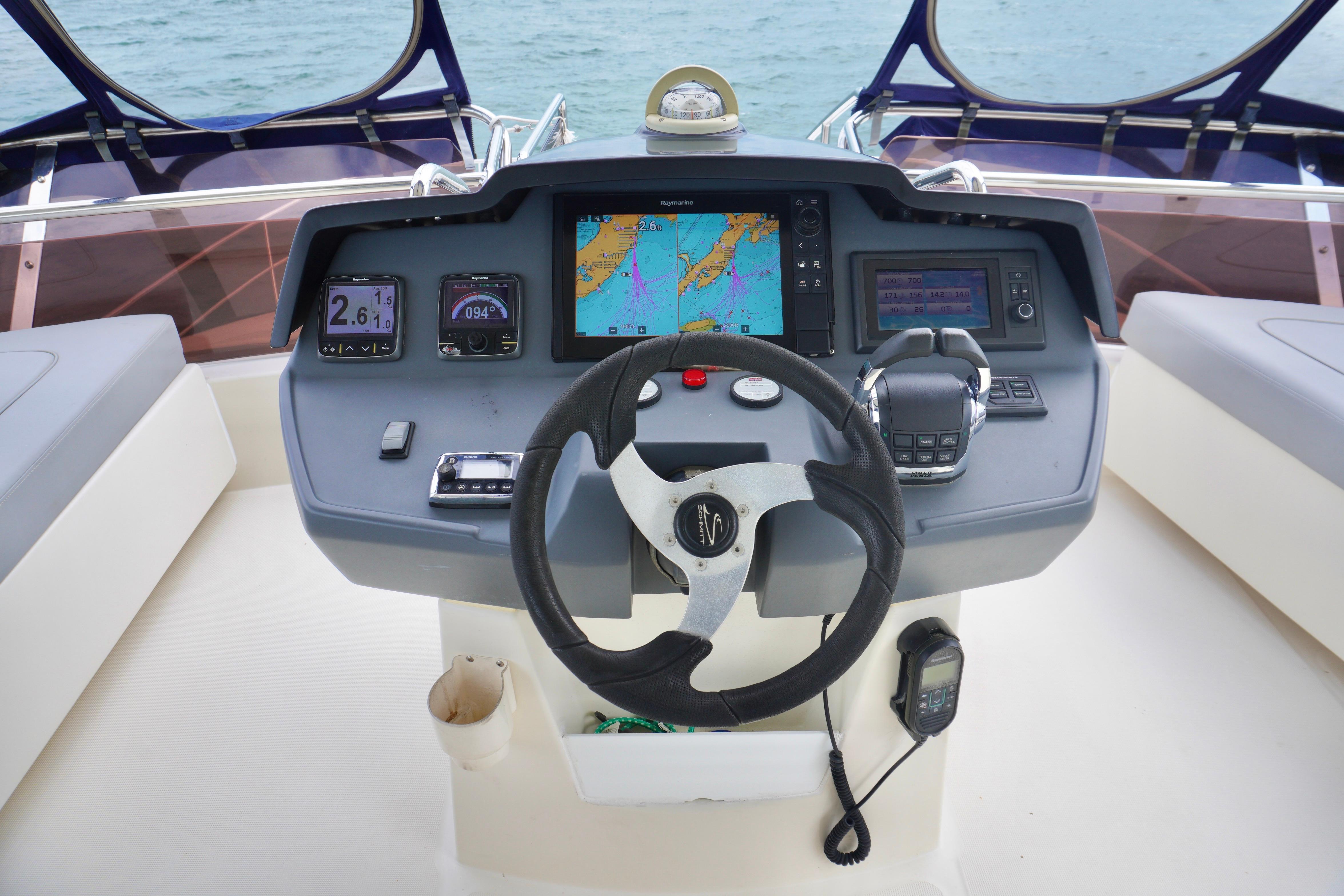Cockpit of 2017 Aquila 44 Yacht with navigation controls and display screens.