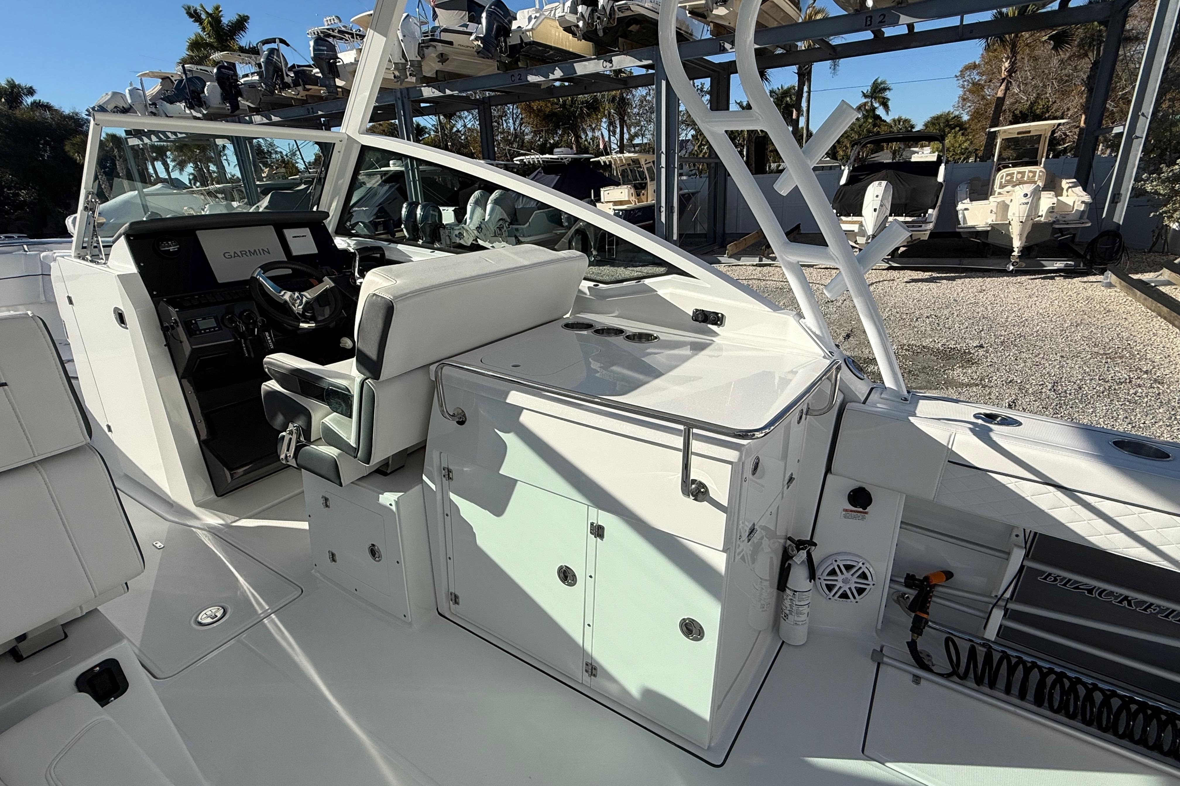 2022 Blackfin 272 DC boat interior with helm and seating area.