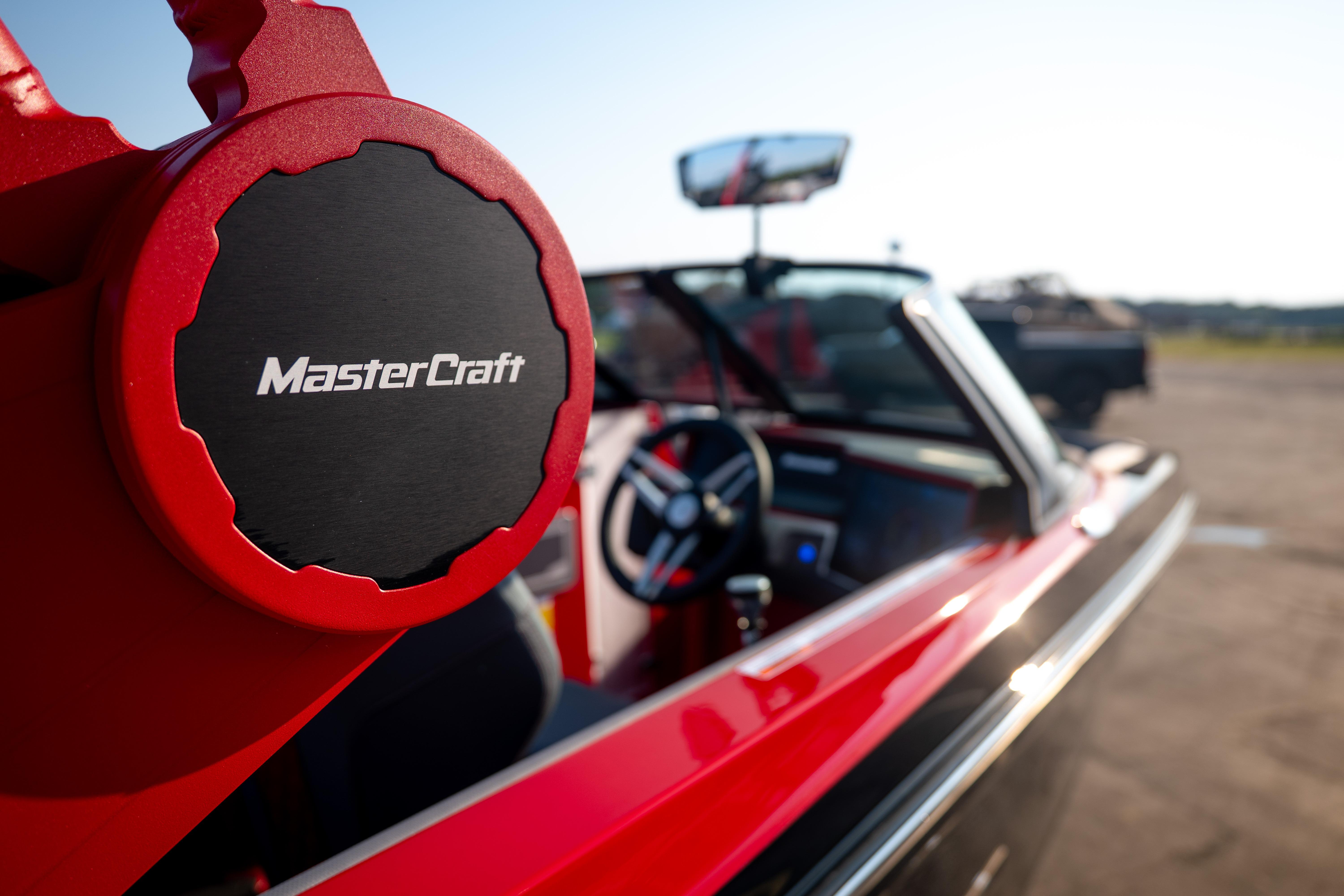 2027 MasterCraft XT24 boat interior with steering wheel and logo detail.