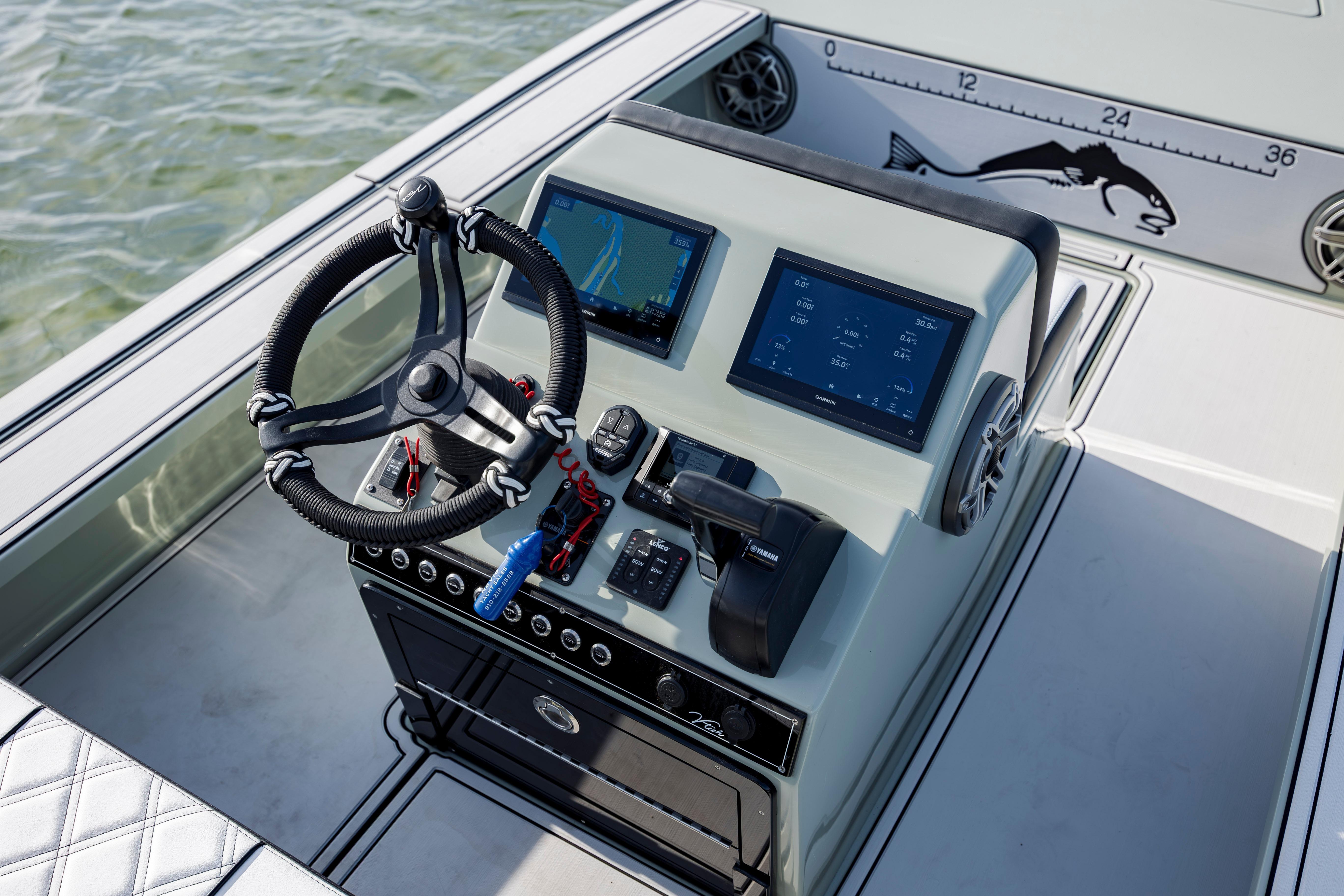 Steering console of 2025 Vtech 18 boat with dual screens and controls.