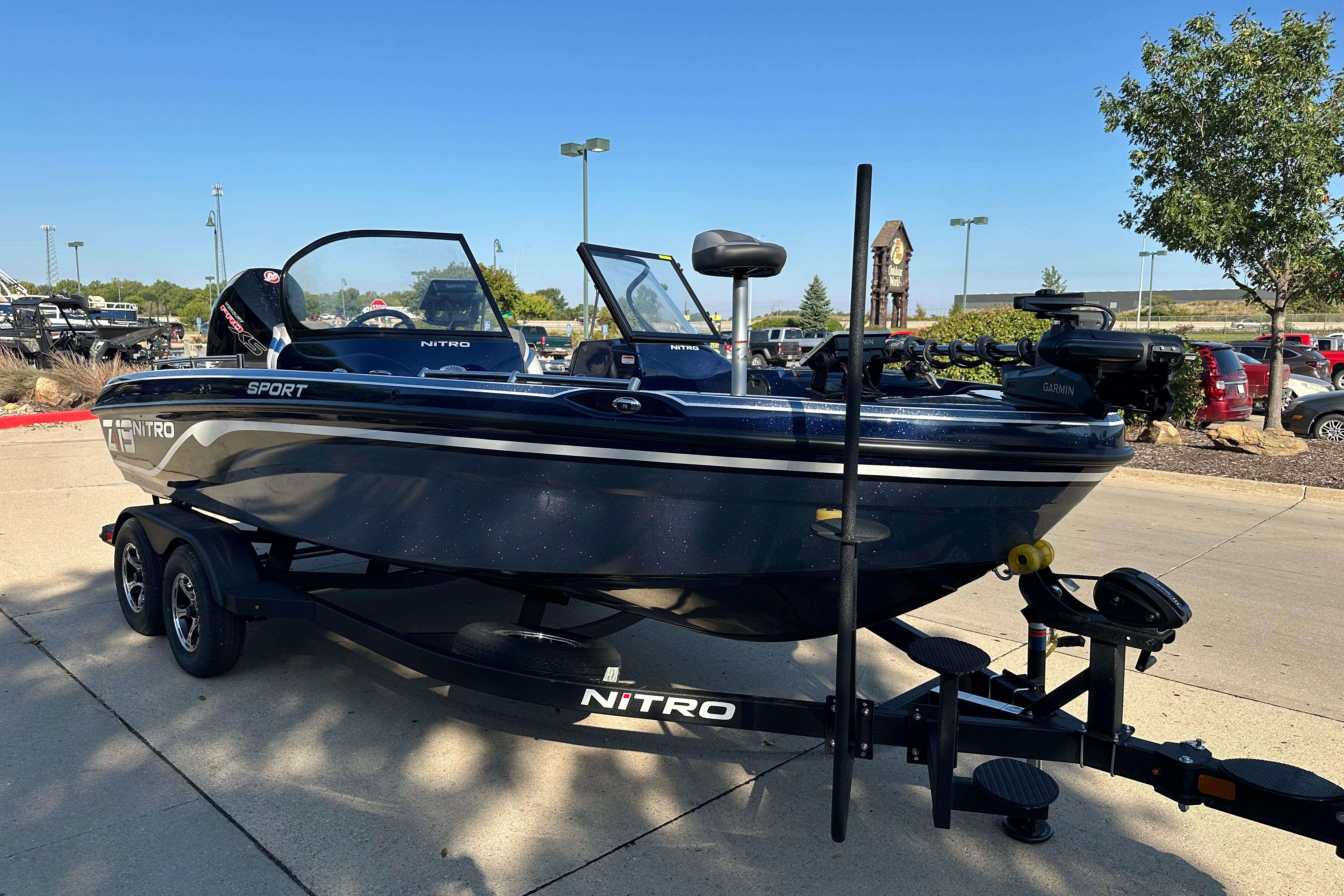2026 Nitro ZV19 Sport Pro boat on trailer in parking lot, sunny day.